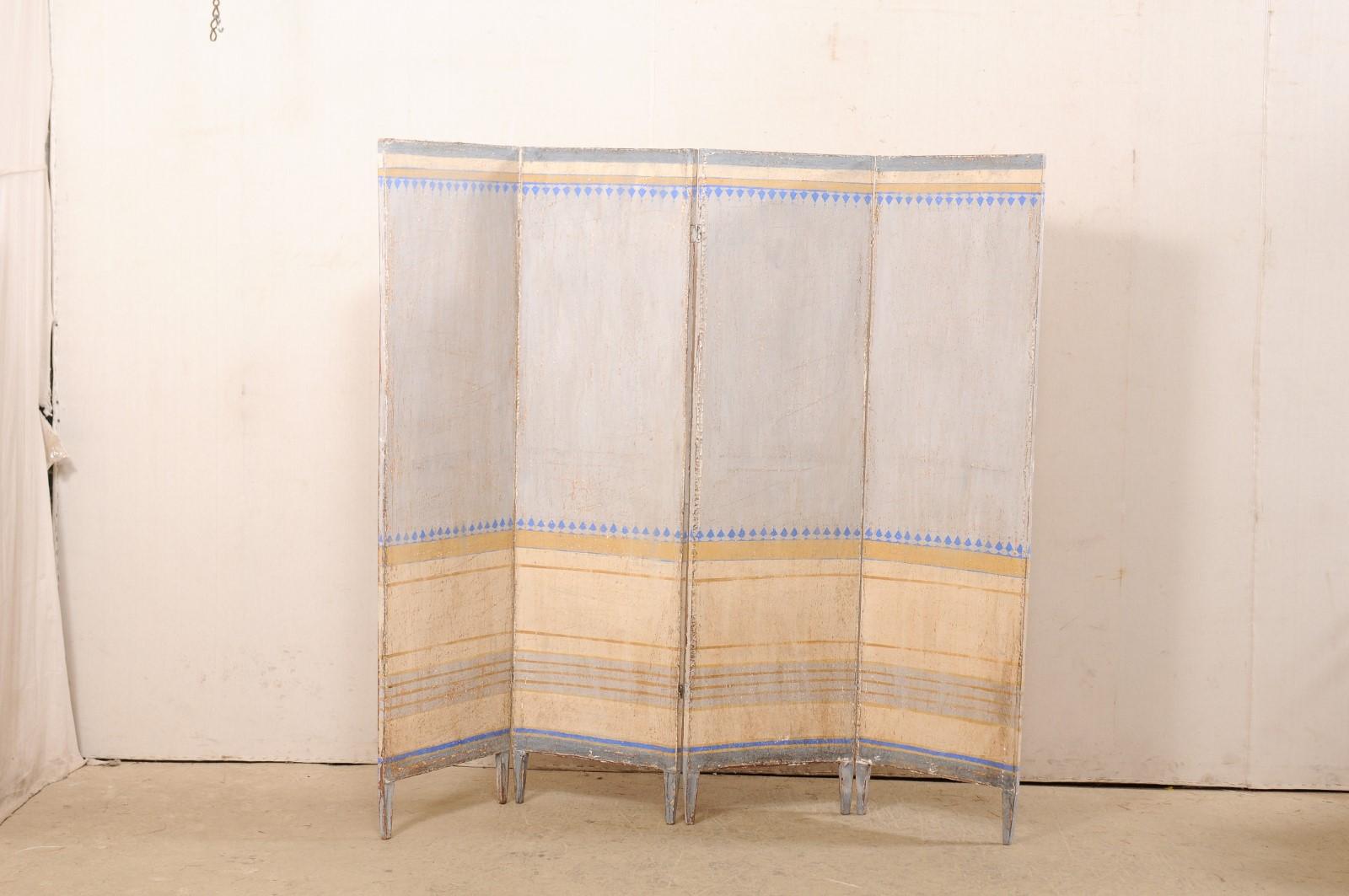 An Italian hand-painted folding screen or room divider. This vintage accordion style folding screen from Italy features four tall sections, connected with hinges, giving this piece a height just over 6 feet, and approximately 6.5 feet wide when