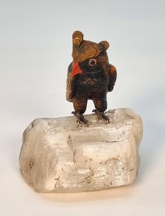 An Italian hardstone carved owl, c 1930 standing on a polished stone base, C1930
