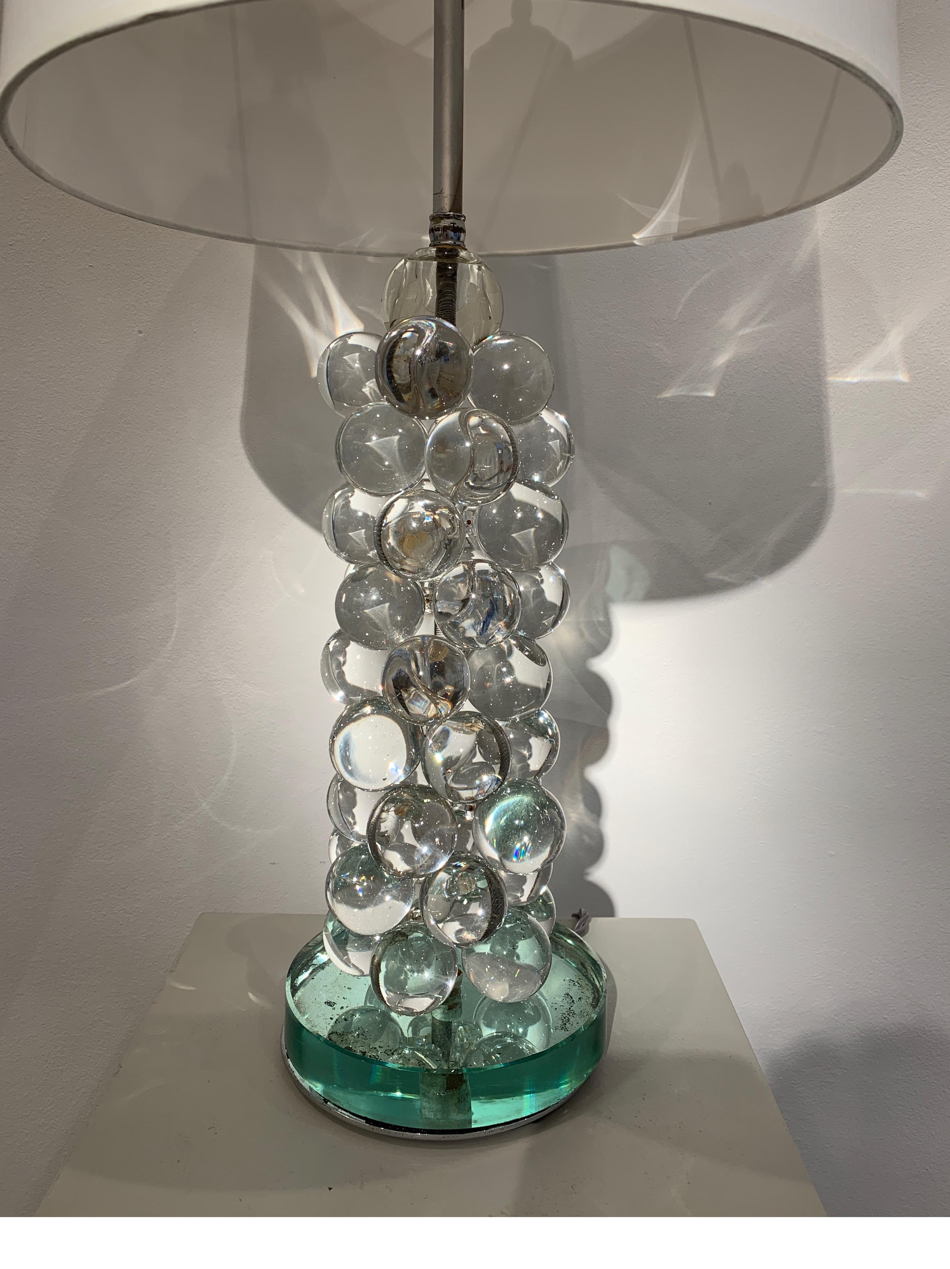 A decorative almost contemporary lamp. Created circa 2000, with glass beads. It achieves a highly decorative rendering.