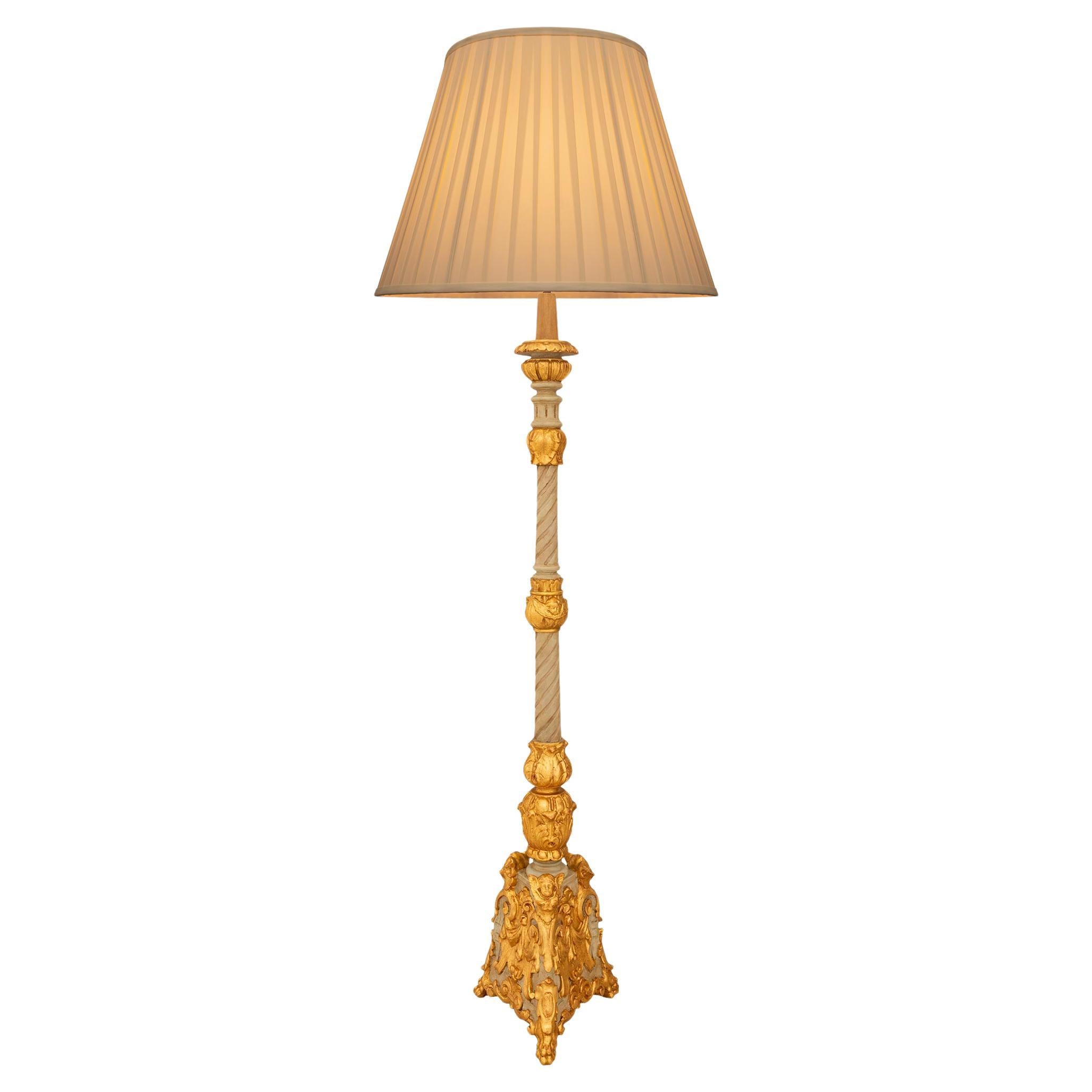 An Italian late 18th century Baroque st. patinated and Giltwood lamp