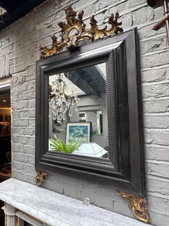 An Italian Late 19th Century Ebonized And Gold Gilt Mirror