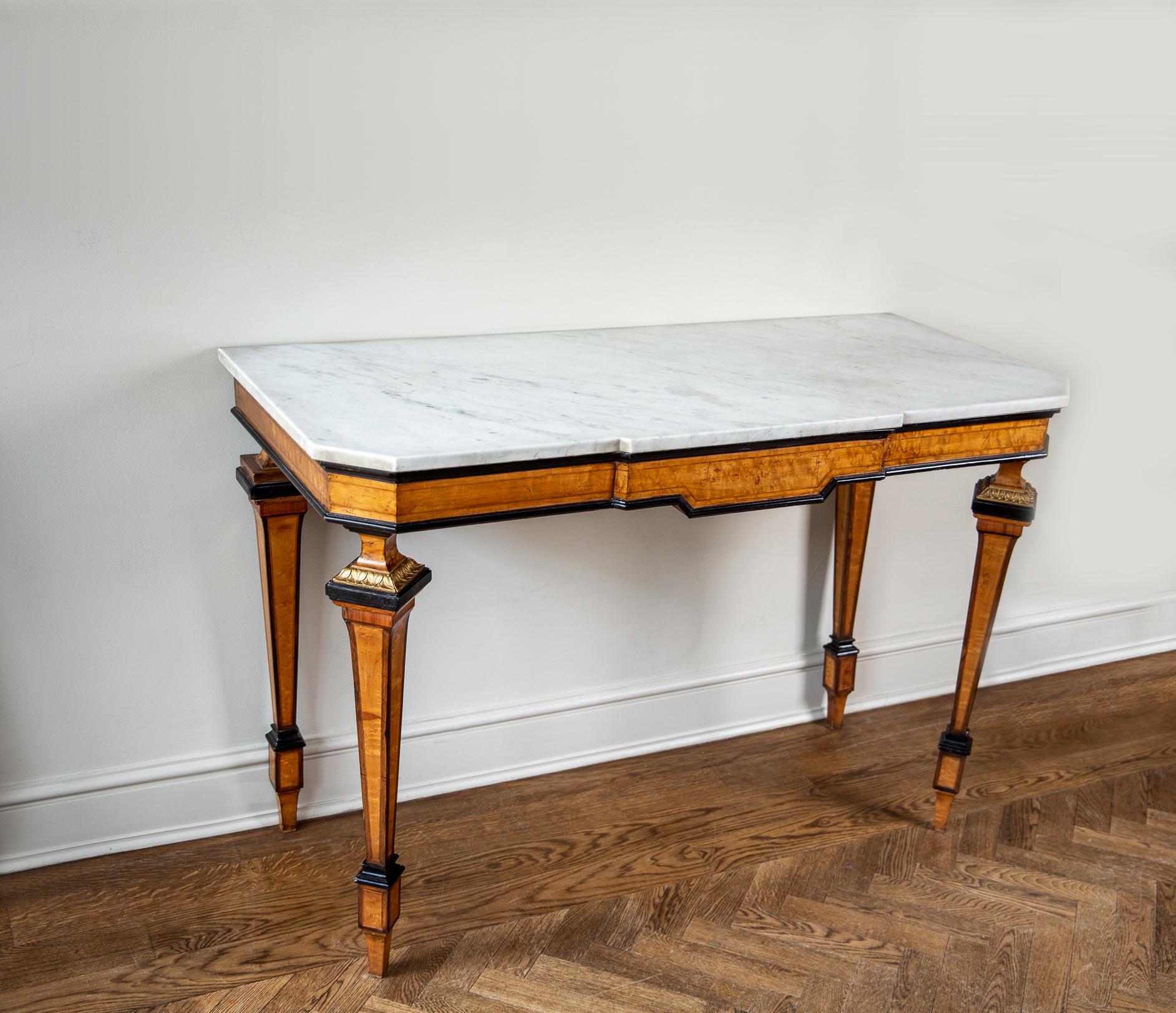 Carrara marble topped console table. A mid-19th century console table constructed of maple veneer on hard wood with graphic ebonised edging and contemporary angular design.

 