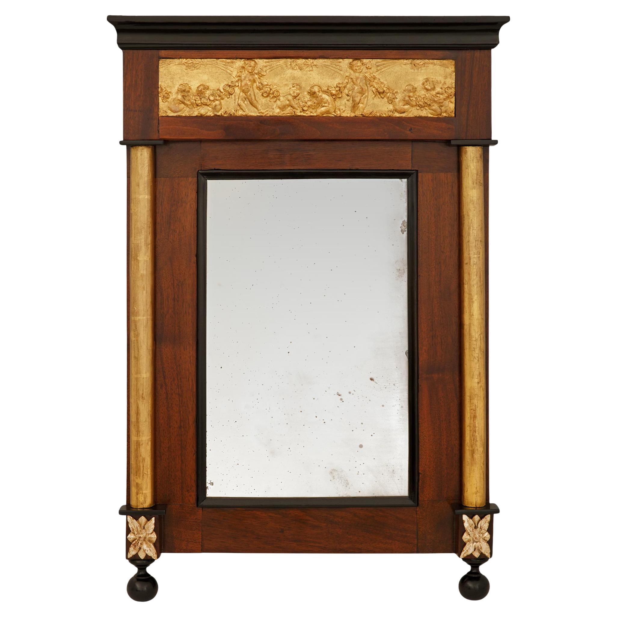 An Italian mid 18th century Neo-Classical st. Mahogany, ebonized Fruitwood, Gilt