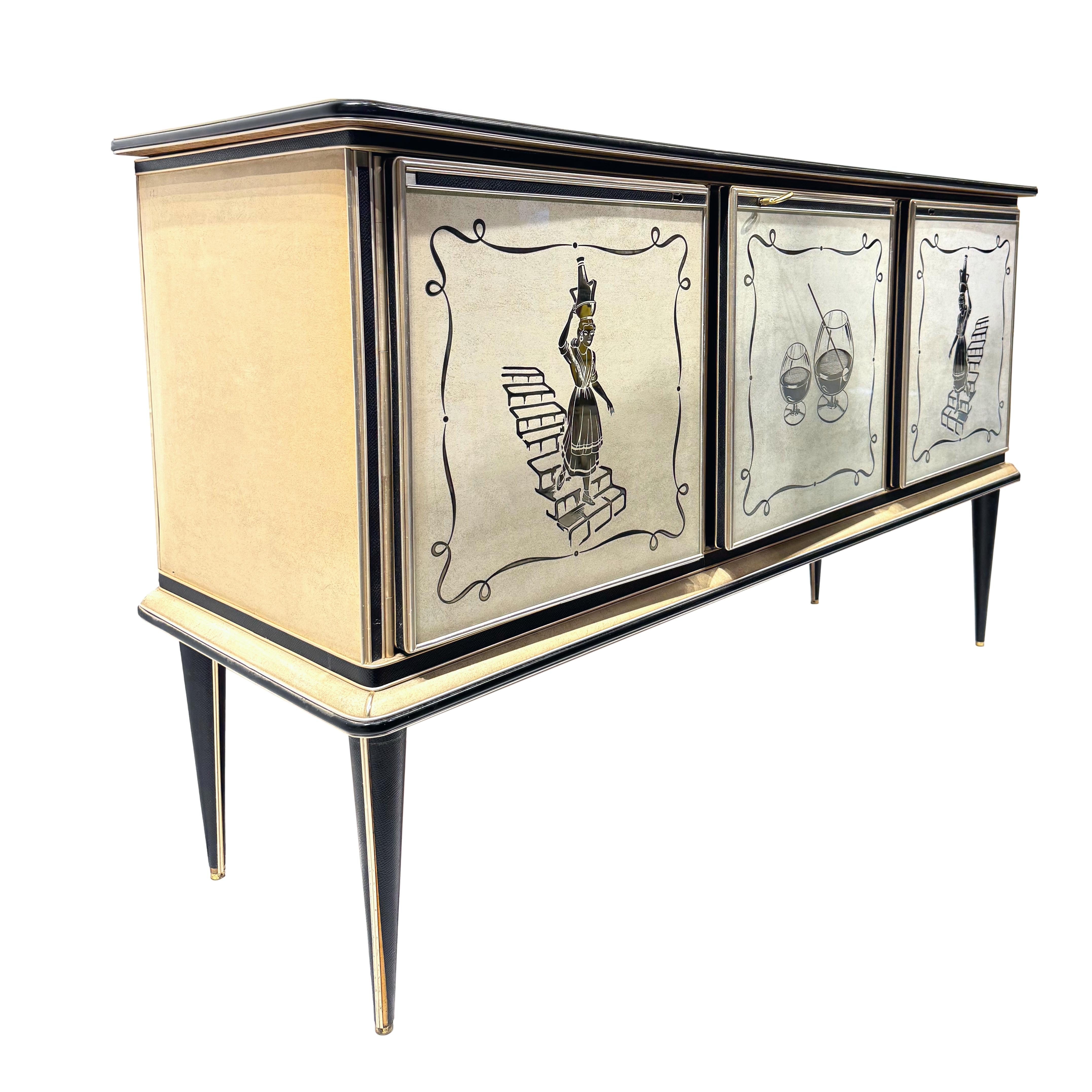 Mid-Century Modern credenza by Umberto Mascagni, covered in cream textured vinyl; banded, mounted, and molded with anodized aluminum, the three reverse-painted cabinet doors with a female figure descending a staircase carrying a wine ewer on either