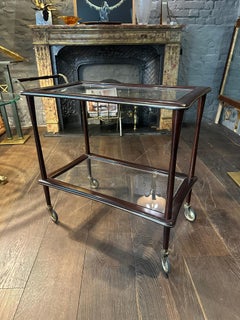 An Italian Mid Century Walnut And Brass Bar Cart