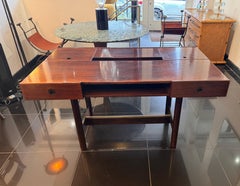 An Italian multi compartments walnut desk by Bernini