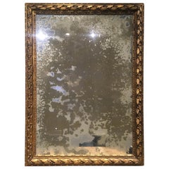 Miroir italien sculpté en bois doré de style néoclassique