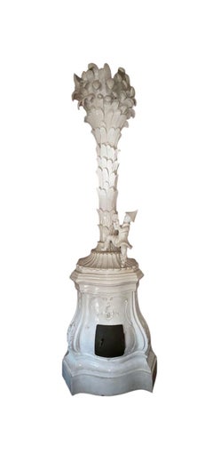 An Italian or Austrian Chinoiserie Off White Glazed Terracotta Stove