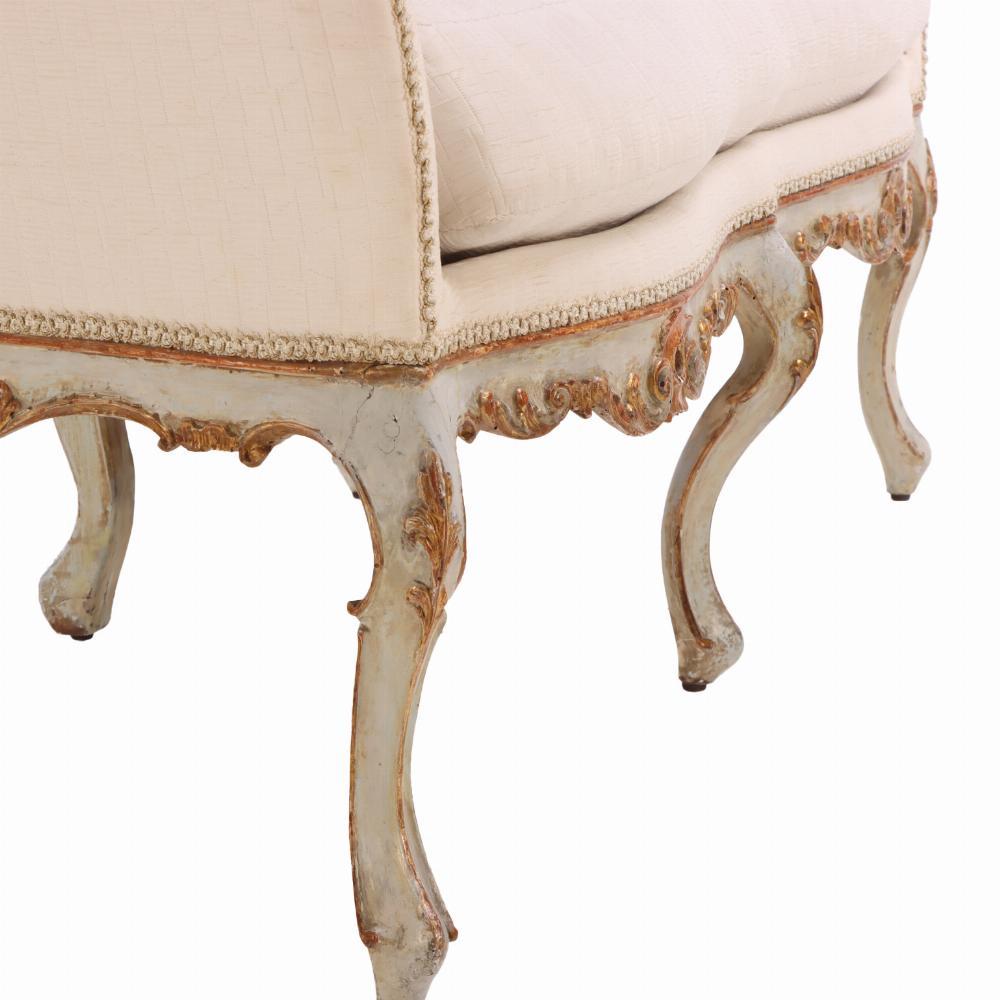 Hand-Carved An Italian painted and carved settee, 18th C., in recent fabric. For Sale