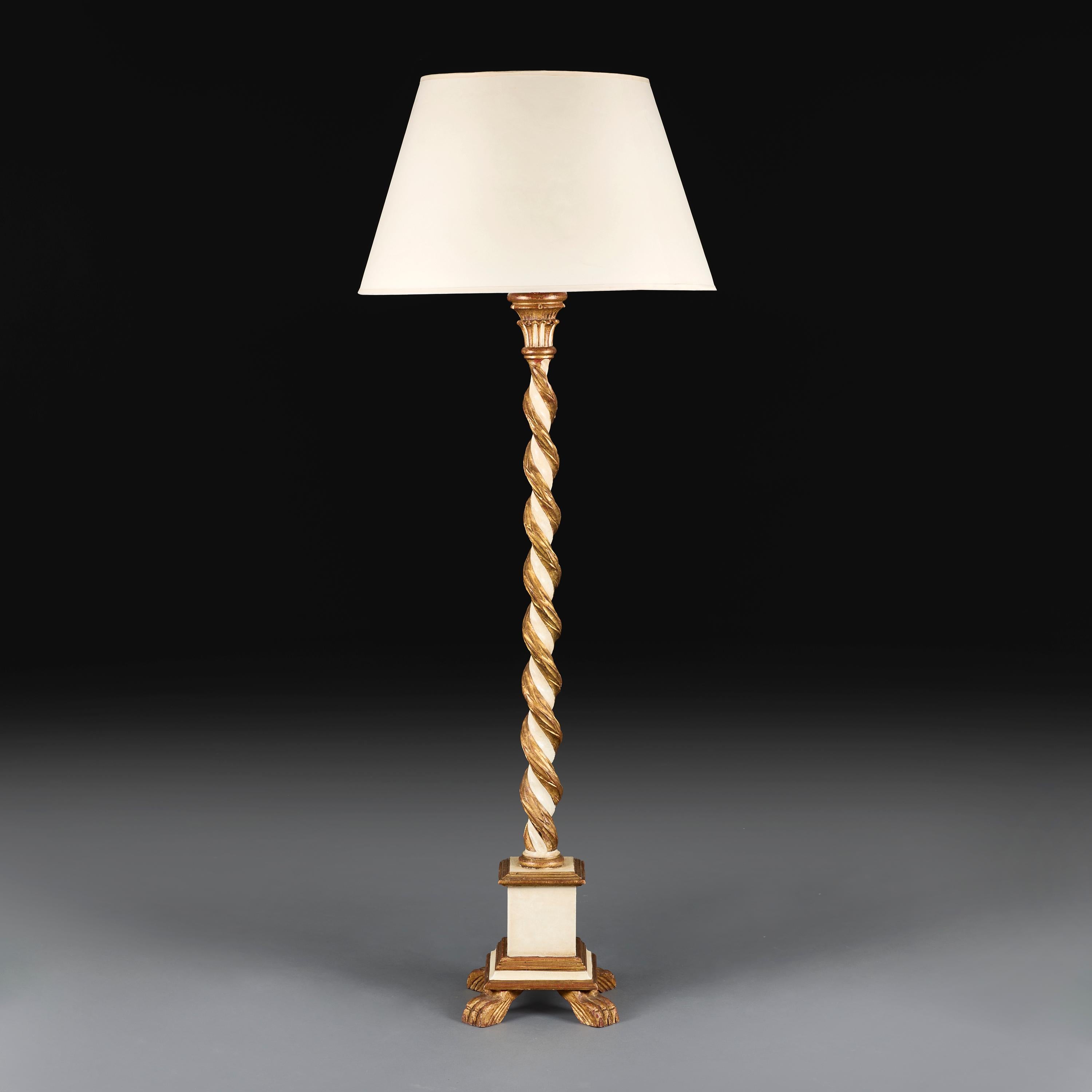Italy, circa 1900

An Italian cream painted Solomonic column candlestick with gilded foliate decorations, all supported on a square base with hairy paw feet, now converted into a lamp.

Height 125.00cm

Width 27.00cm

Depth 27.00cm

Please
