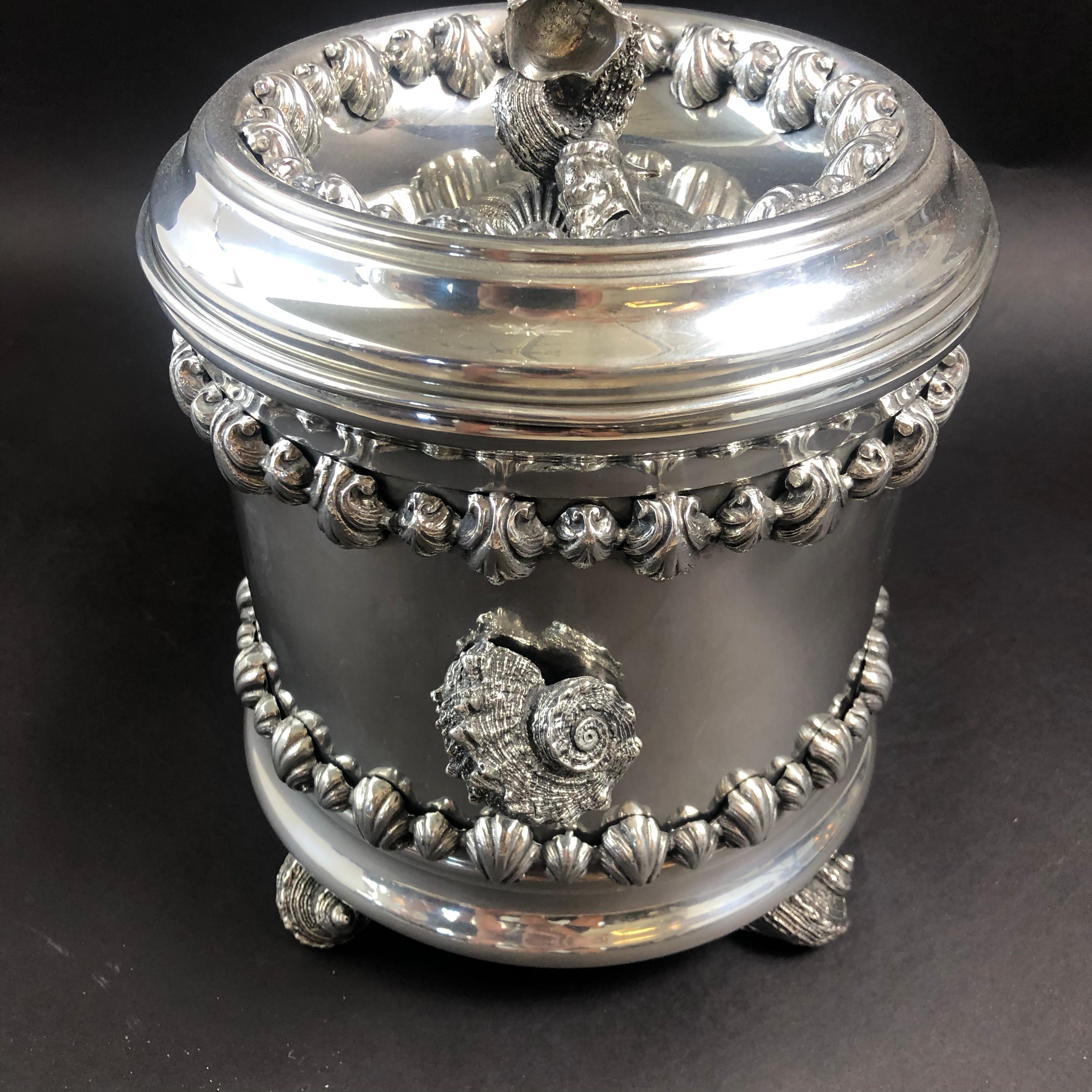 An ornate pewter covered ice bucket, made by Richard Cipolla in Lombardia, Italy. The handmade piece has a beautiful patina. Made with the highest grade pewter. It contains no lead or aluminum alloys. This particular ice bucket has a nautical motif