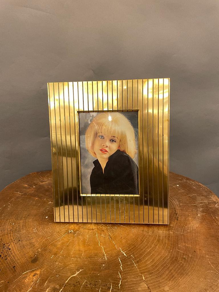 An elegant pictures frame in brass in the style of Cartier. Italy 1960s.