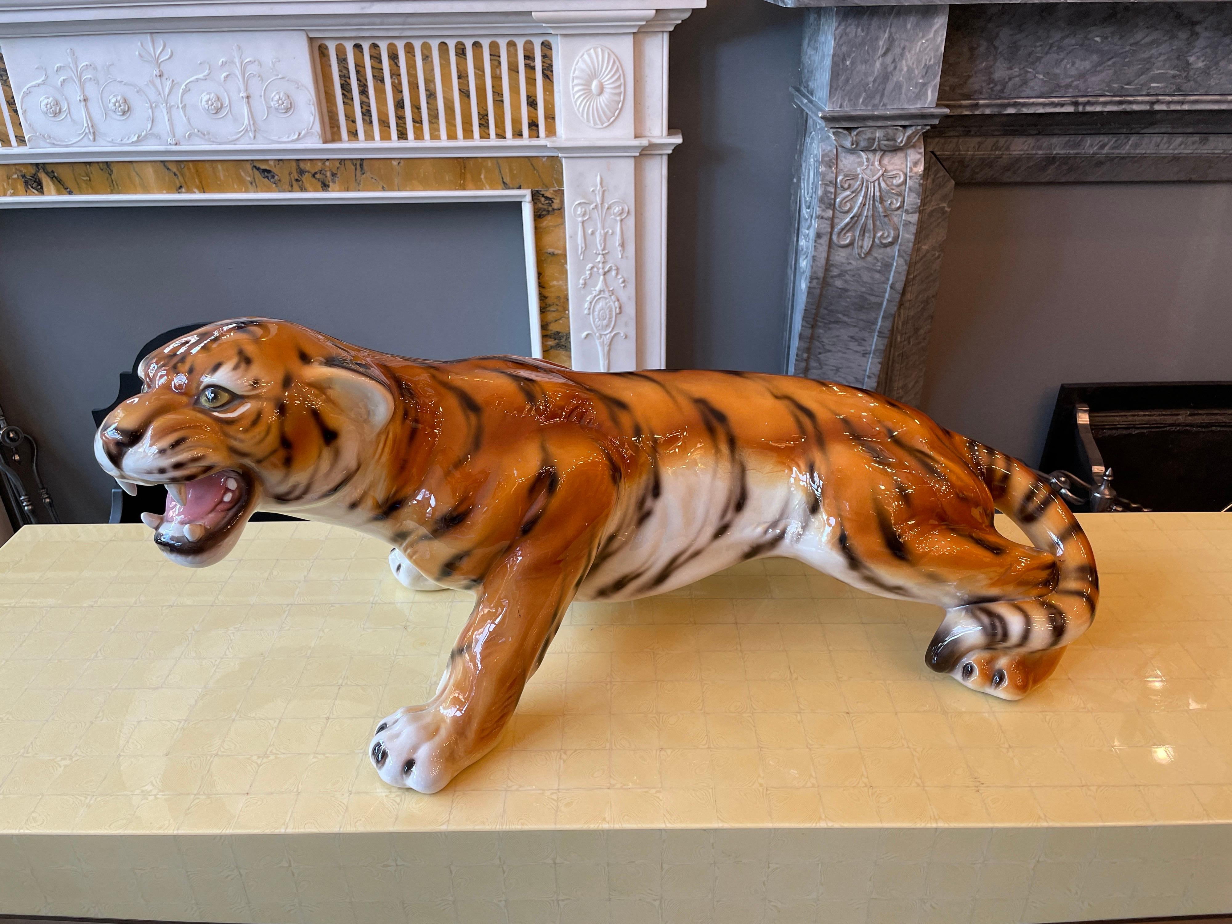 A large Italian polychromed ceramic tiger, vibrant colour and in pouncing position. Italian Circa 1960.