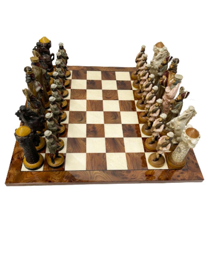 An Italian polychrome very large wooden chess set

An Italian polychrome large wooden chess set on a burr walnut wooden chessboard. The Noble chess pieces of polychrome wood come from Italy around 1930. The king is 22 cm (8.7 Inch) high. The