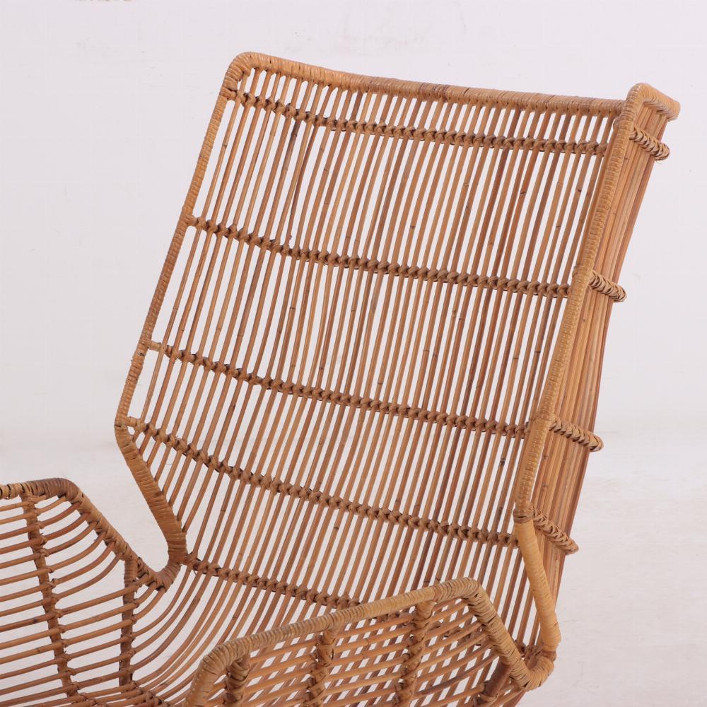 Rattan An Italian rattan lounge chair in the manner of Gio Ponti, C. 1960. For Sale