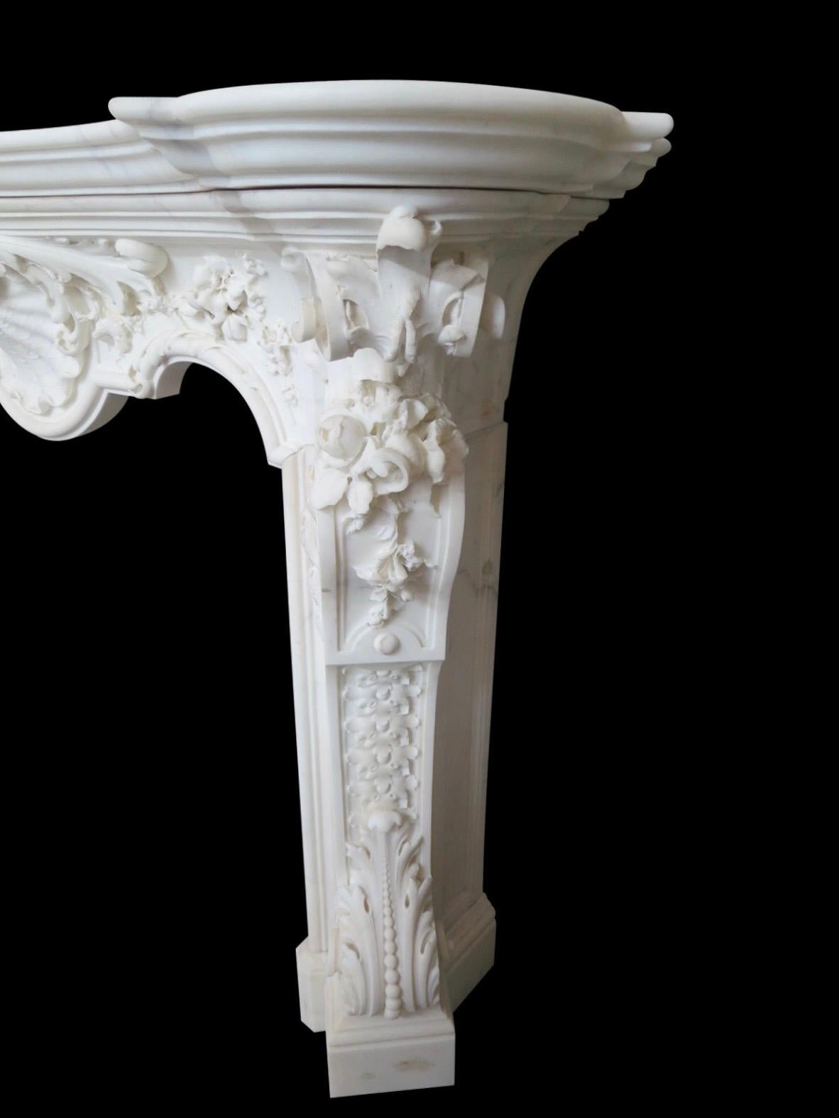Hand-Carved An Italian Rococo Revival Statuary White Marble Fireplace Mantel For Sale