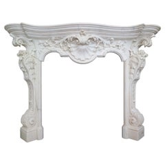 An Italian Rococo Revival Statuary White Marble Fireplace Mantel