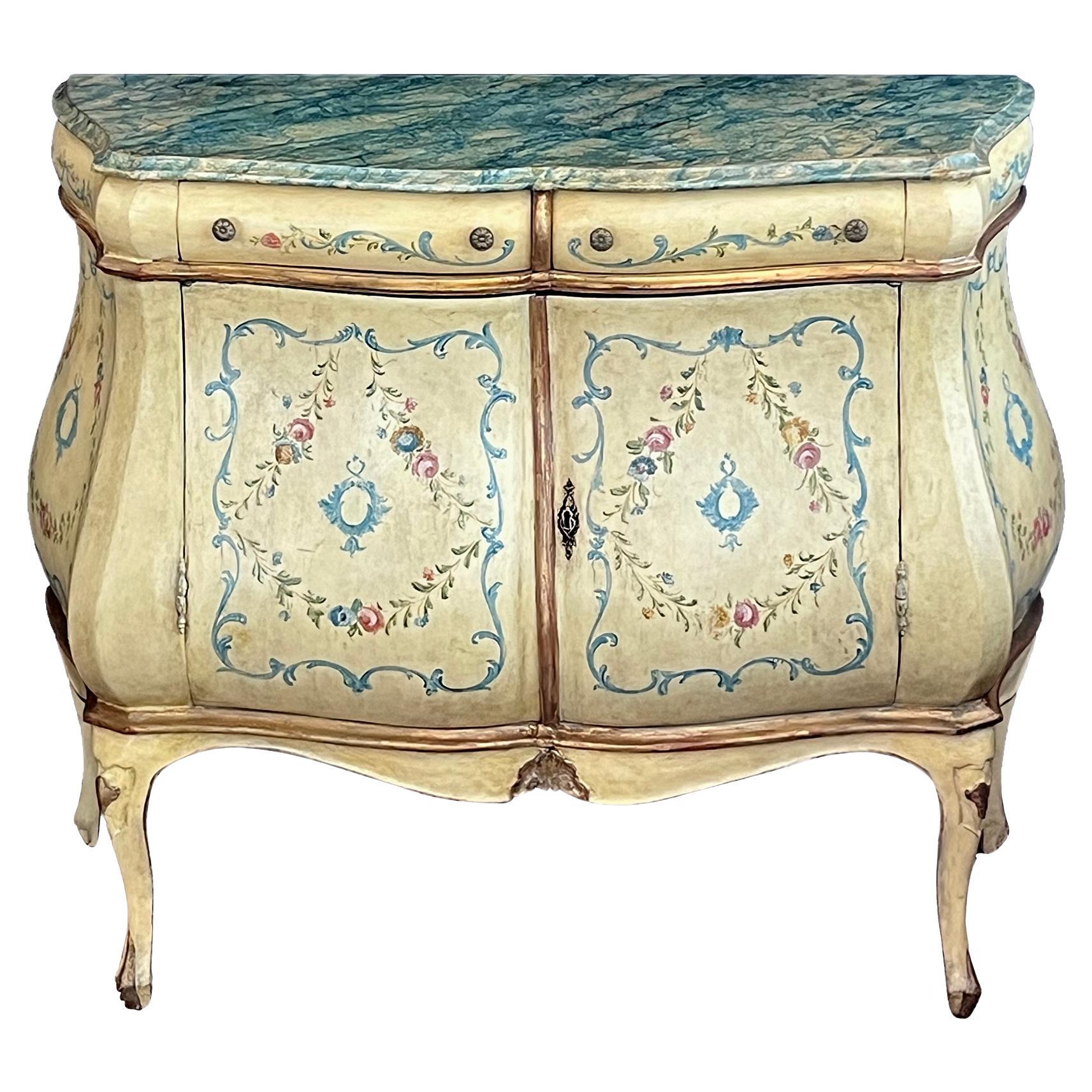 An Italian Rococo Style Butter-yellow Painted Bombe Cabinet