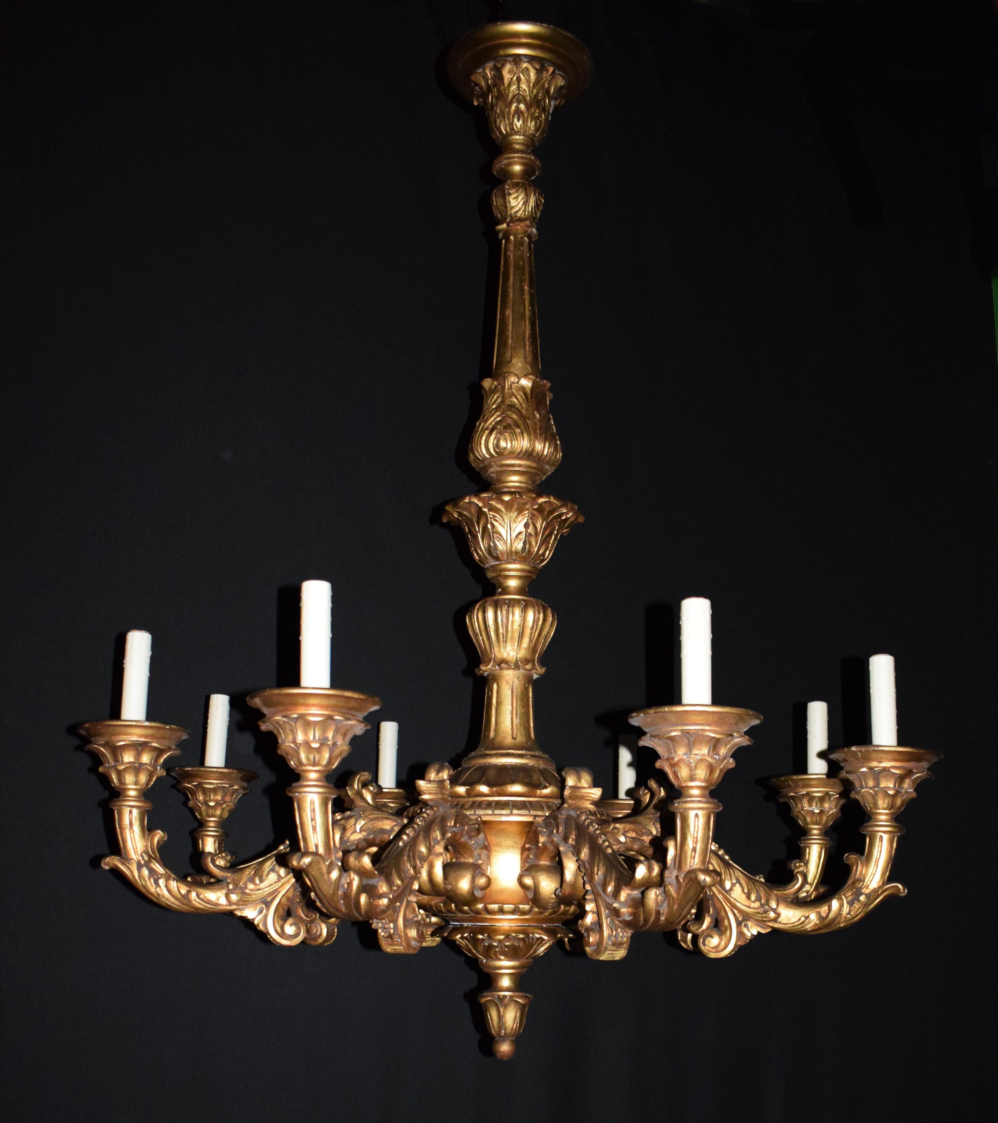 An Very Impressive Italian Rococo style giltwood eight-light chandelier. 
Italy, circa 1900.
Dimensions: Height 66 x diameter 54 inches.
CW4840.

    