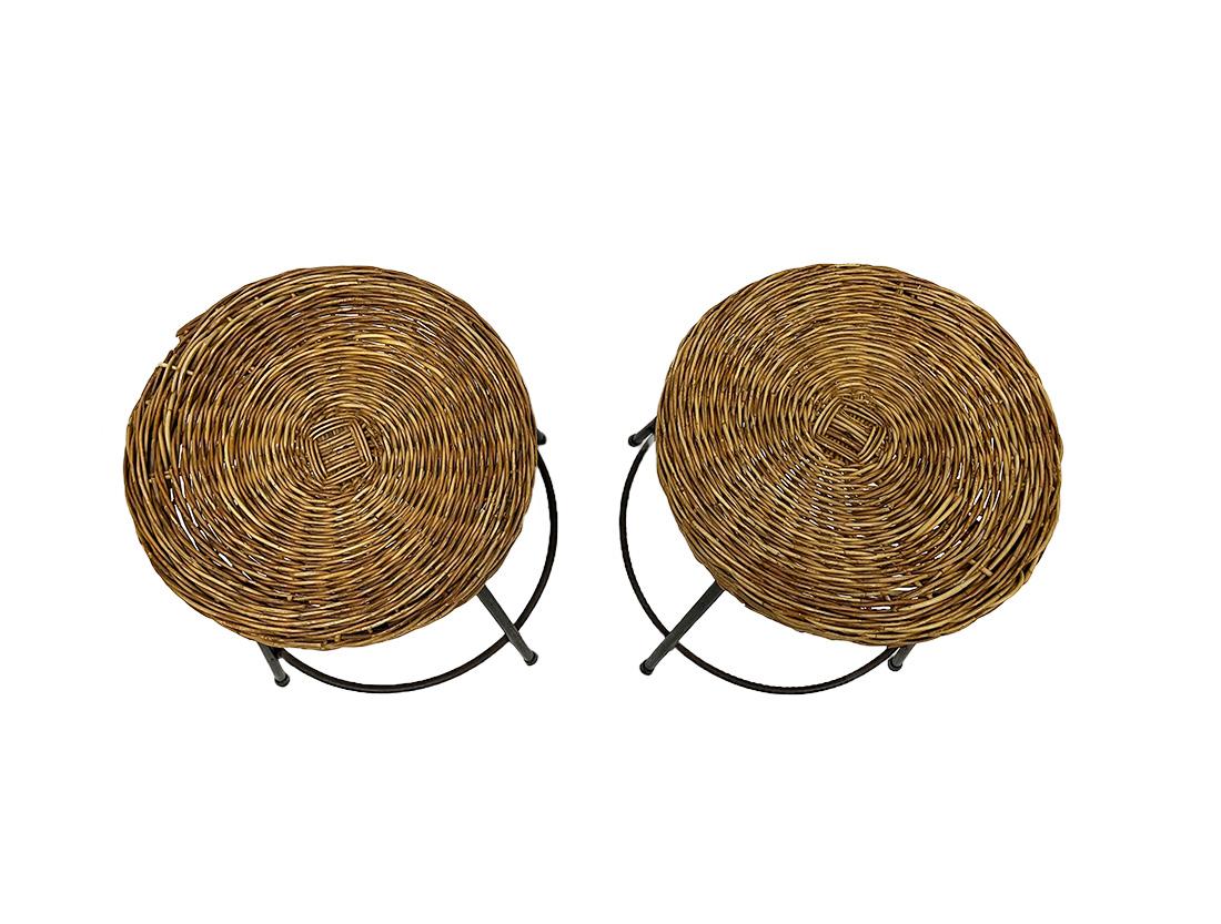 An Italian set of wicker and wrought iron stools, 1950s

Mid-20th Century Italian wicker stools with wrought iron legs, reinforced by a wrought iron ring. The seat made of wicker and reinforced under the seat by means of a wooden slat. 
The