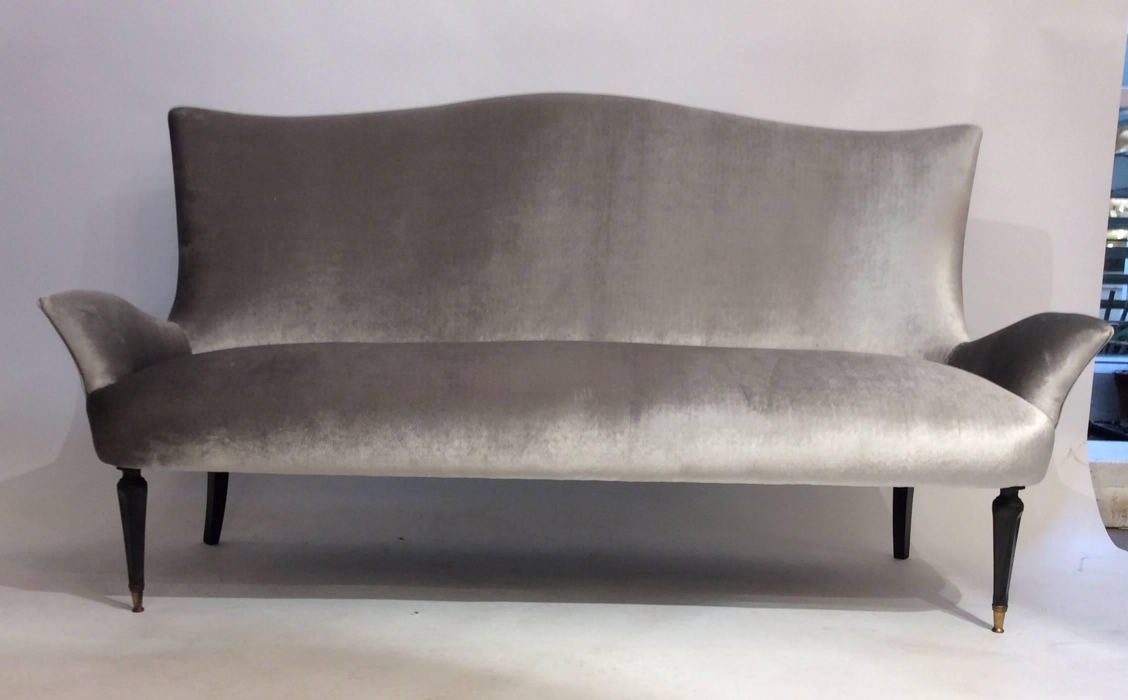 An Italian designed sofa attributed to Gio Ponti reupholstered in velvet circa on ebonized 1940s
There is also a pair of armchairs to create a set which is available separately.