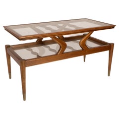 Vintage An Italian teak two tier coffee table with wavy glass supports