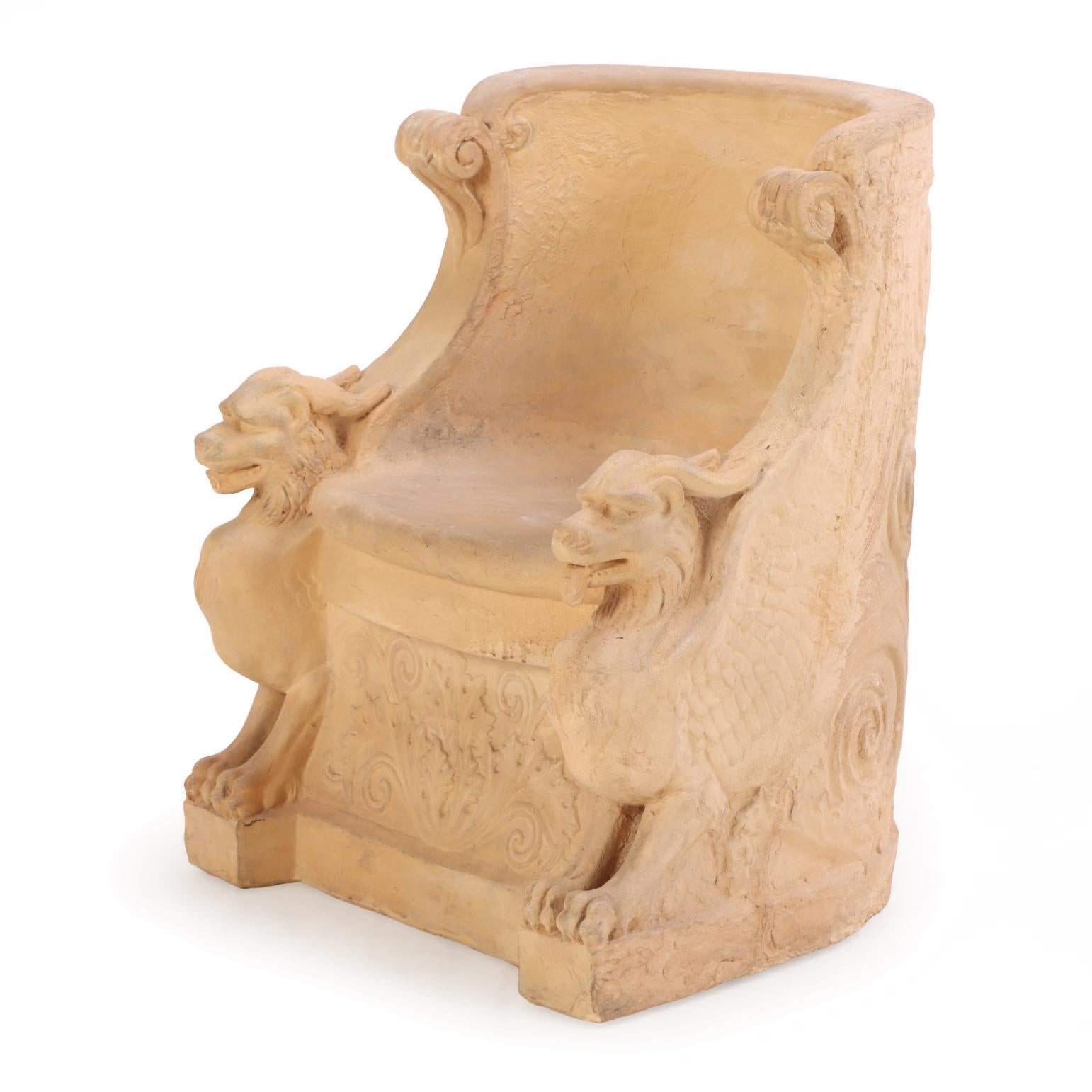 This tub form chair has a rounded back flanked by two chimera with horns and lions faces and paws. The rounded front seat and figures sit atop a plinth base with relief decoration on front and allover the back. A striking blend of classical