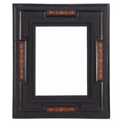 Dutch partial ebonized and inlaid picture frame or mirror frame C 1850.