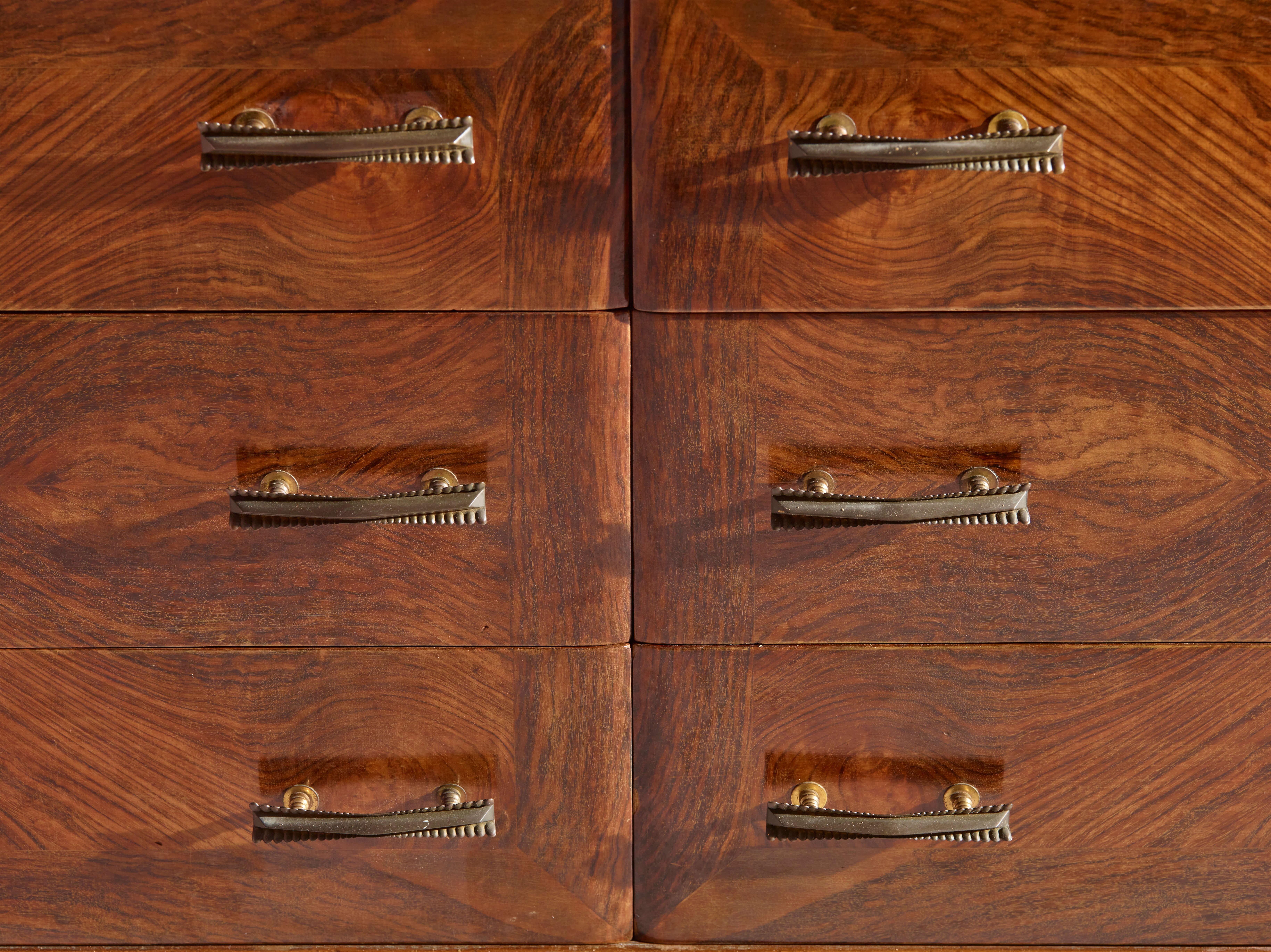 Glass An Italian walnut sculpted chest of drawers with black glass top from the 1940s
