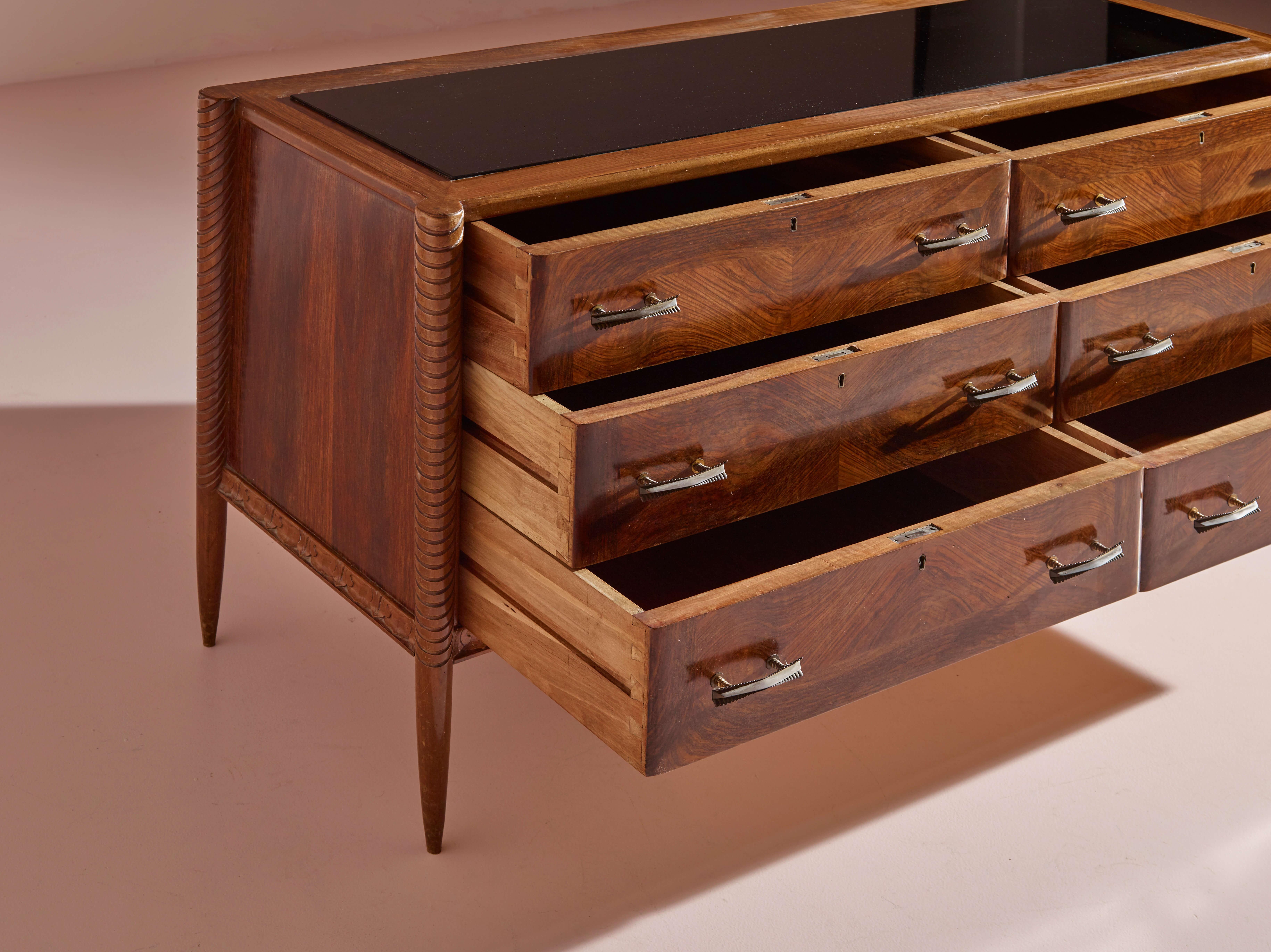 An Italian walnut sculpted chest of drawers with black glass top from the 1940s 2