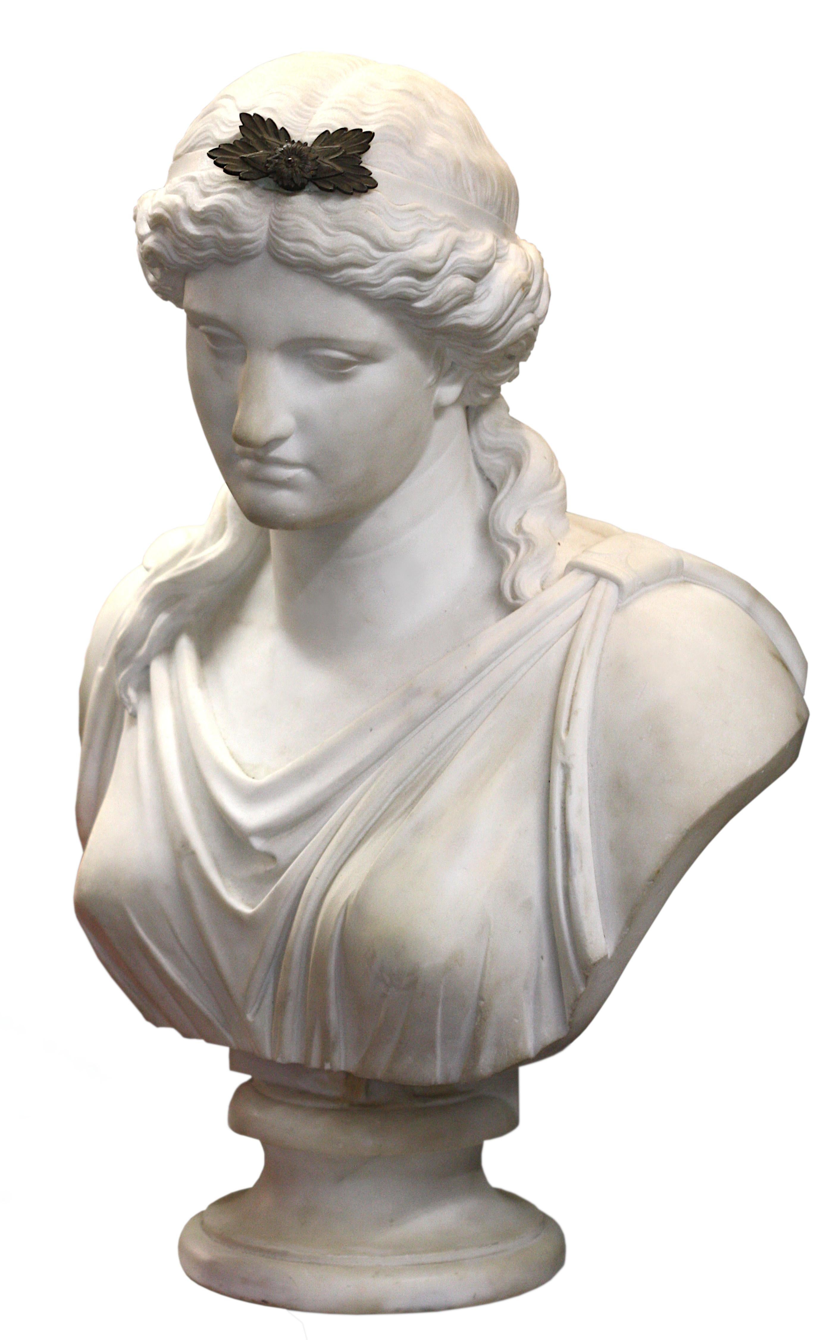 An Italian white marble portrait bust of a Lady, late 19th century, her hair gathered on the top of her head and plated, measure: height 28 in. (71.12 cm).