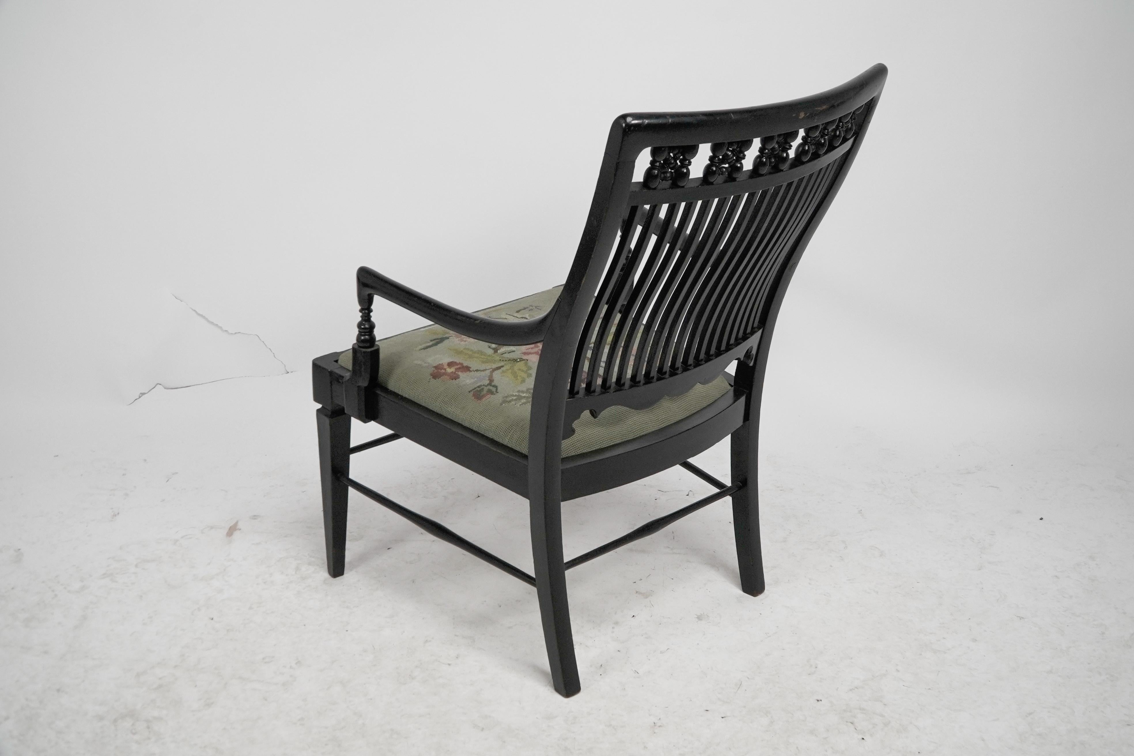Liberty & Co armchair with a shaped back & mashrabiya turnings to the head rest. For Sale 10