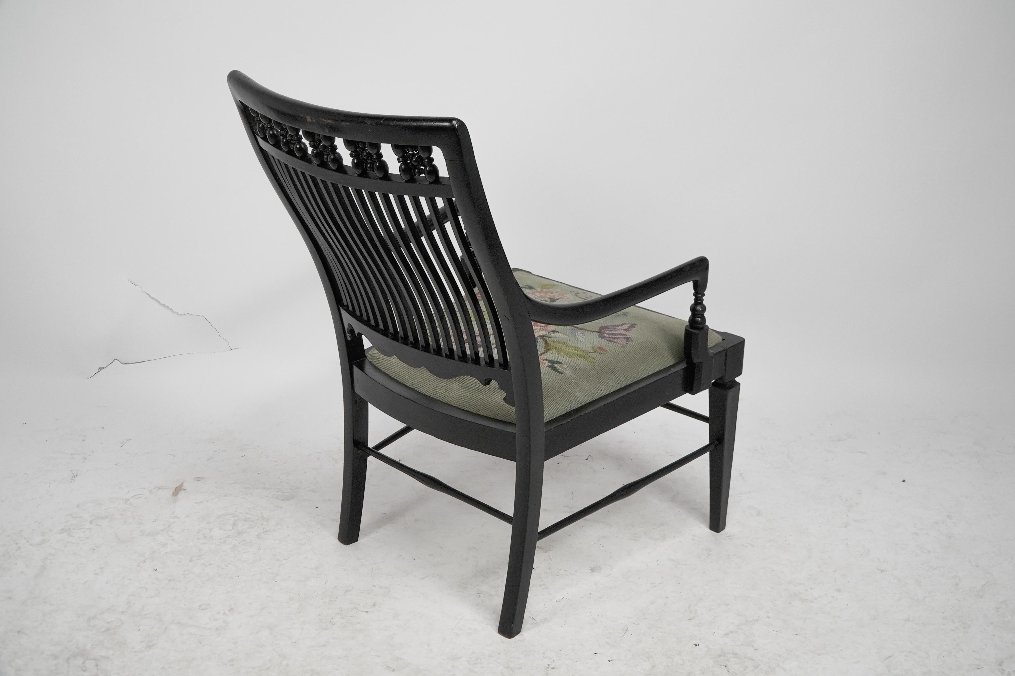 Liberty & Co armchair with a shaped back & mashrabiya turnings to the head rest. For Sale 12