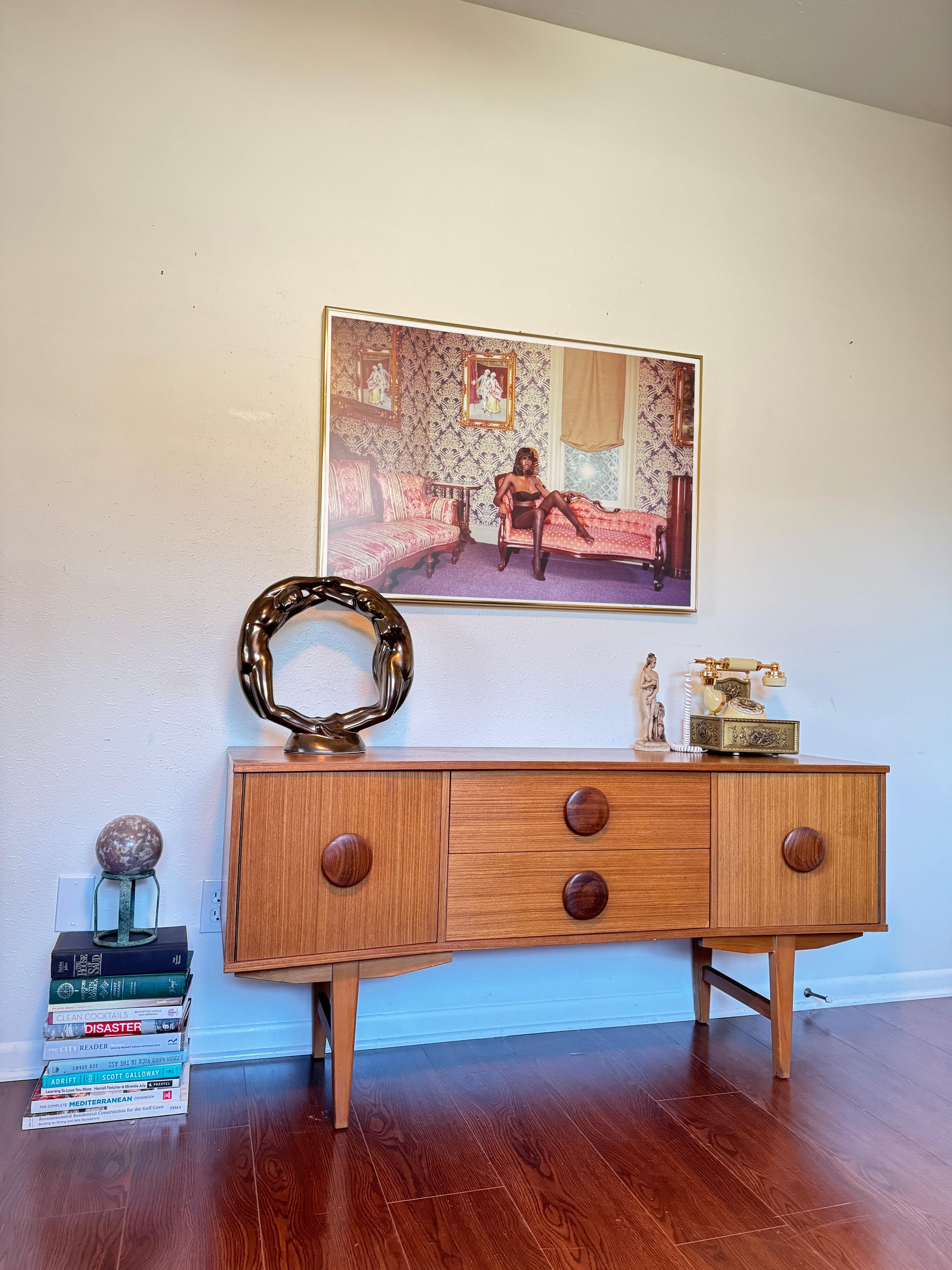 An MCM petite sideboard with button pulls, circa 1960s 3