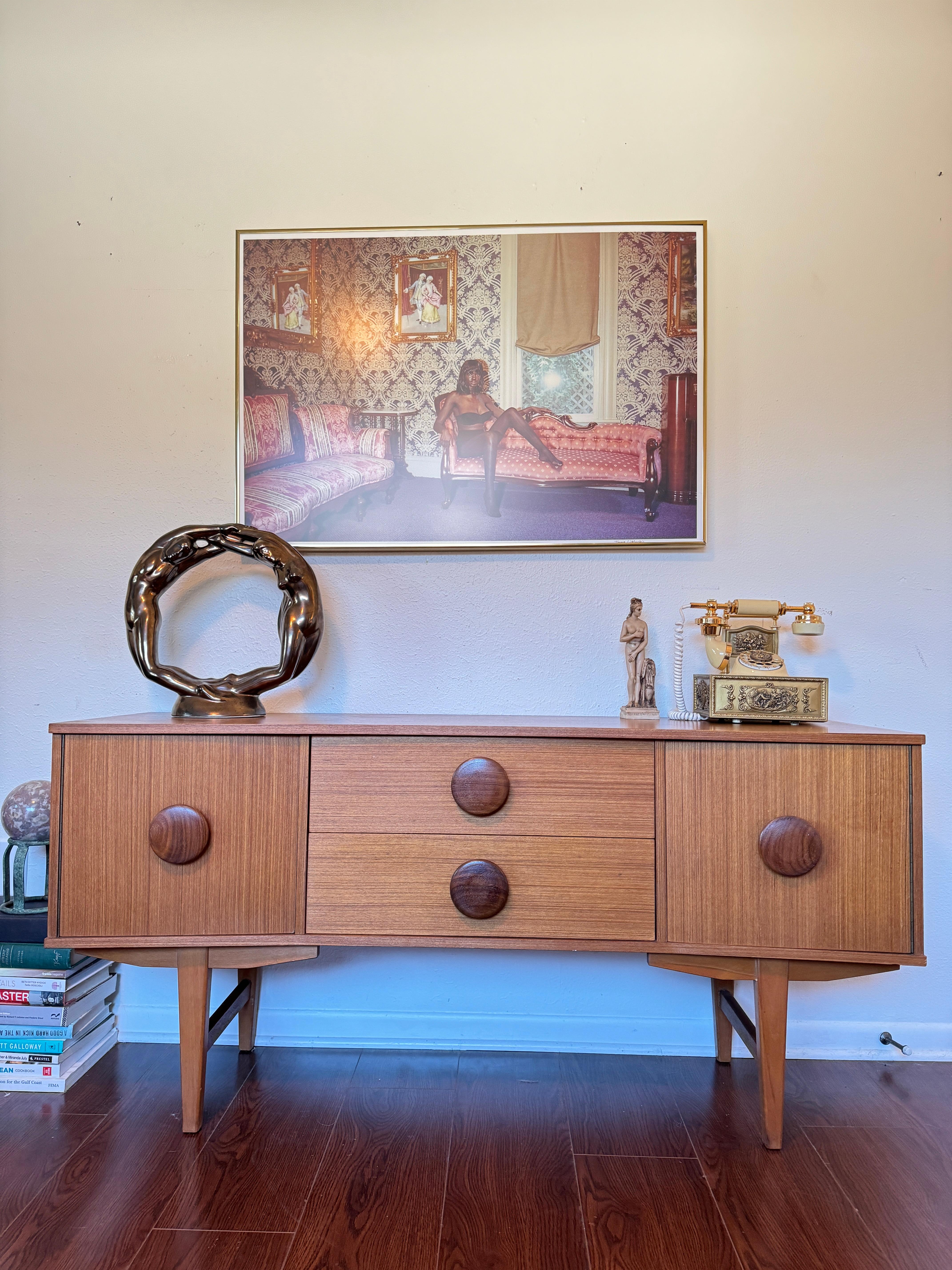An MCM petite sideboard with button pulls, circa 1960s 4