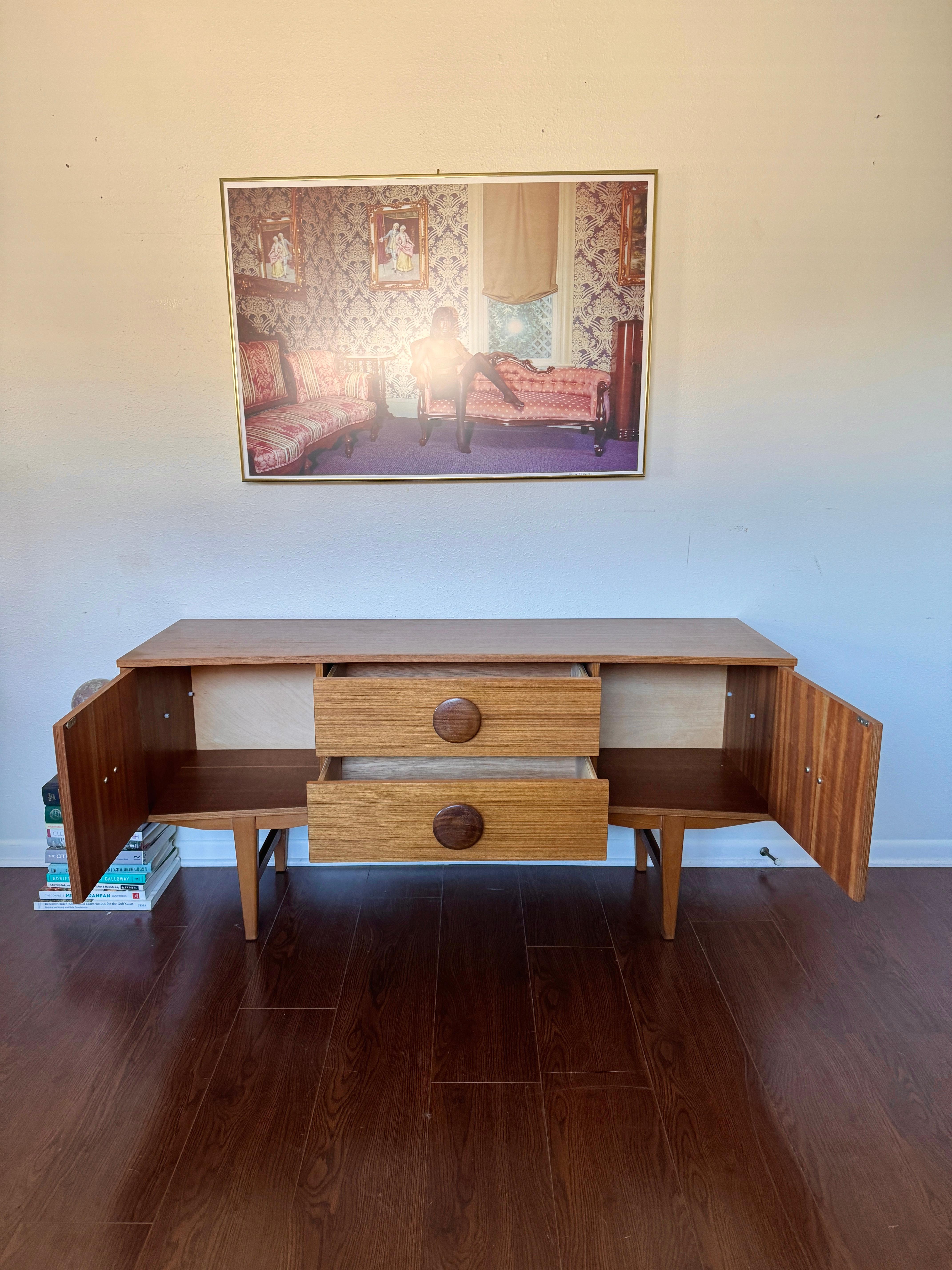 Veneer An MCM petite sideboard with button pulls, circa 1960s
