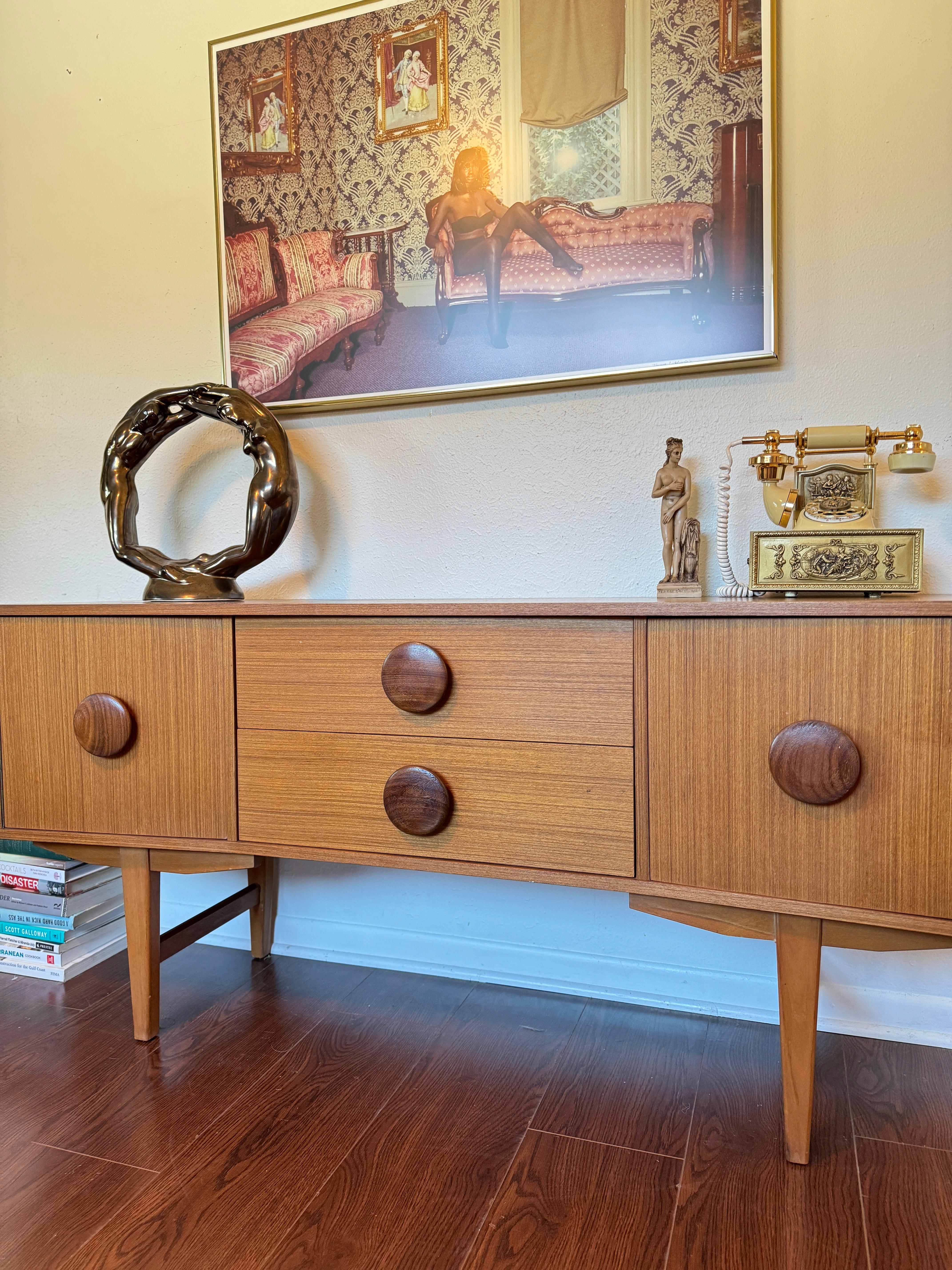 Mid-20th Century An MCM petite sideboard with button pulls, circa 1960s