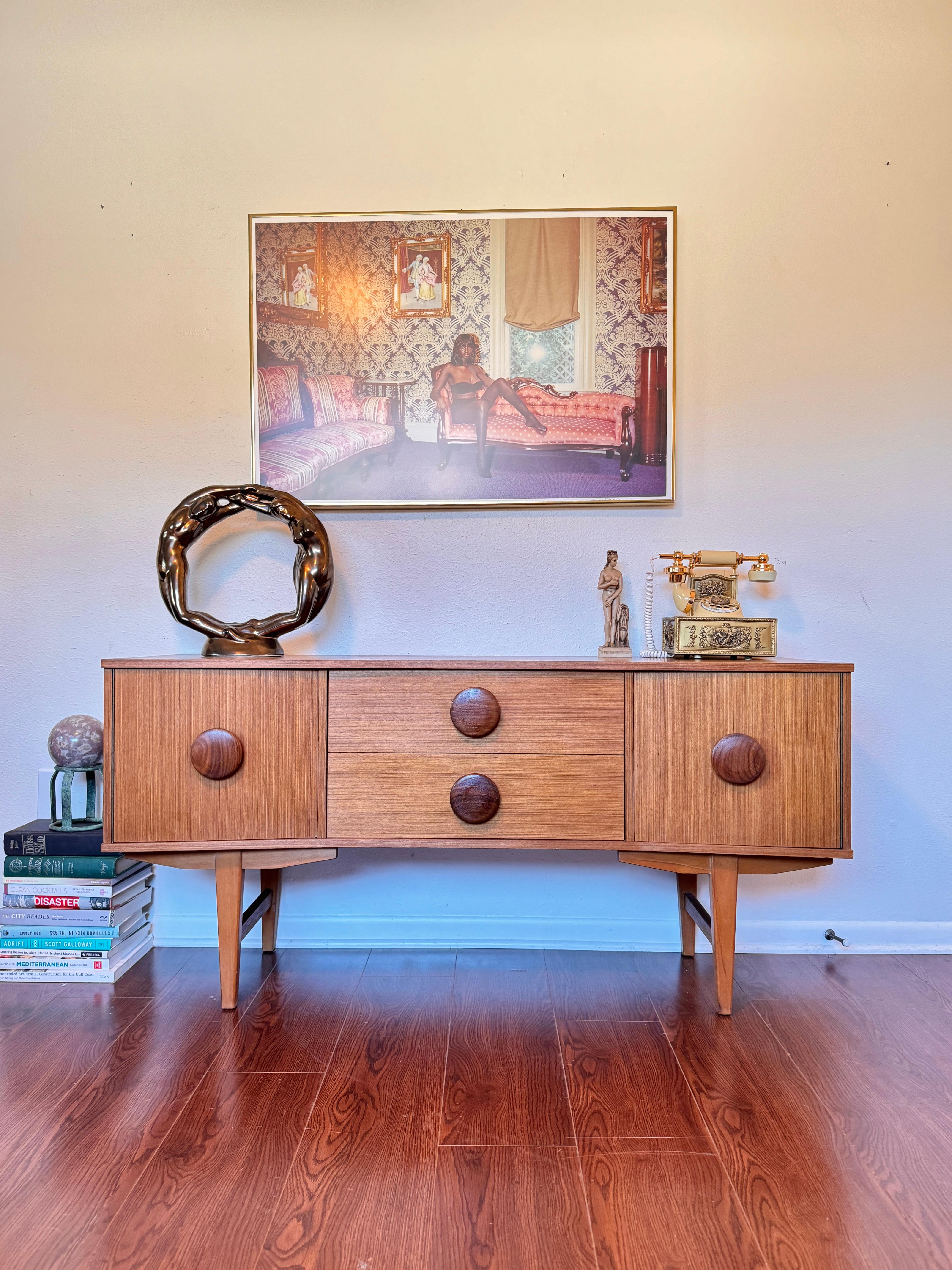 An MCM petite sideboard with button pulls, circa 1960s 1