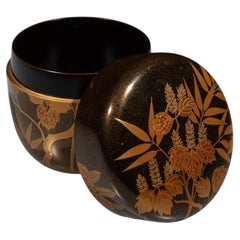 An O-natsume lacquered in the nashiji style with bamboo leaves and vine tendrils