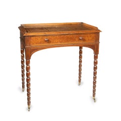 An oak and pollard oak writing table attributed to George Bullock with designs b