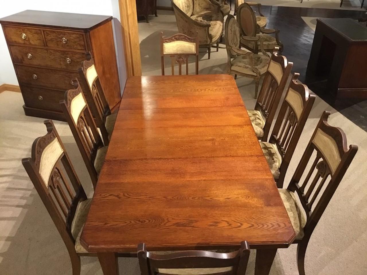 oak extending dining table and 8 chairs