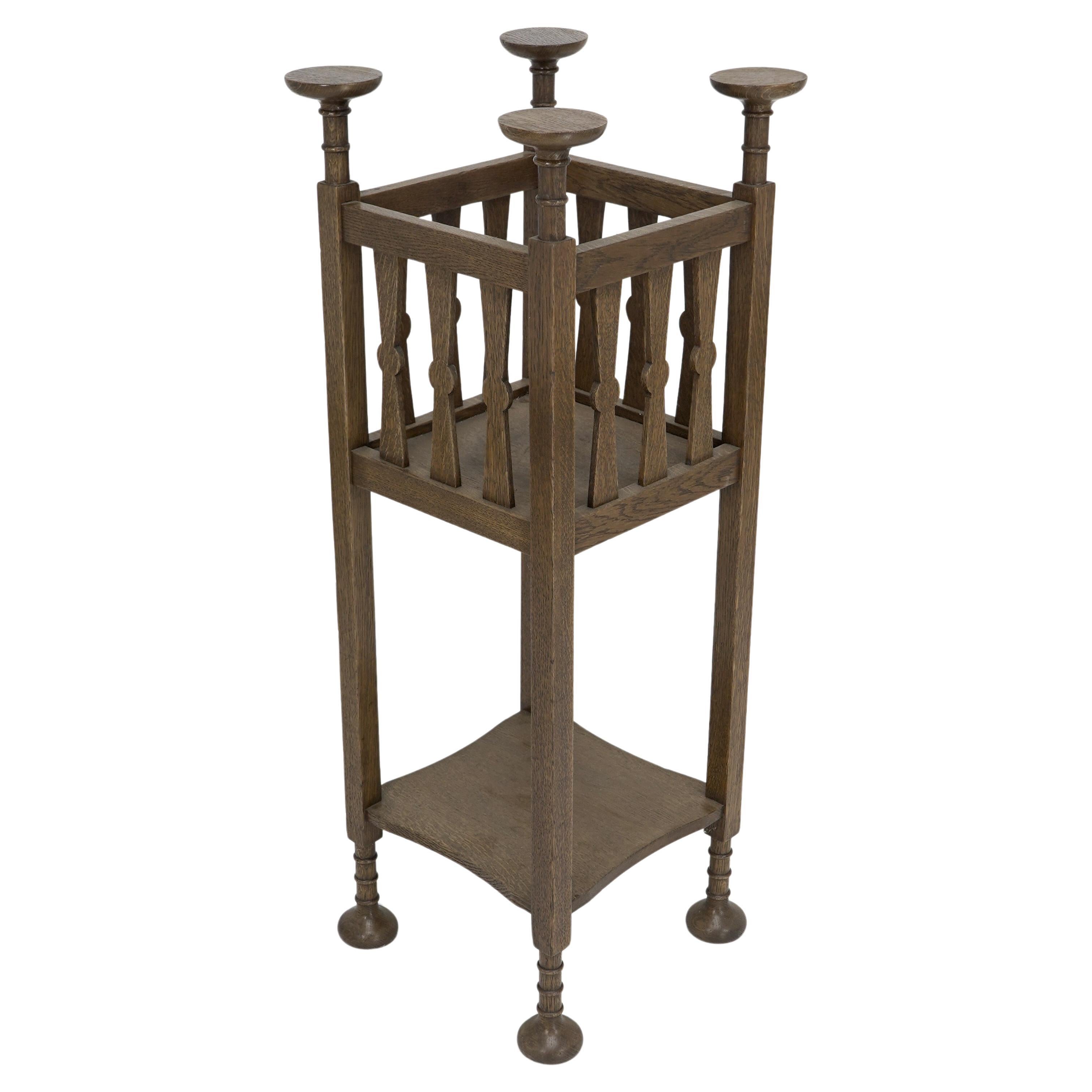 Shapland & Petter. Arts & Crafts oak plantstand with Voysey style disc finials. For Sale