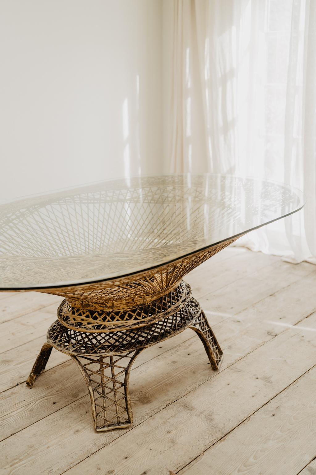 A one of a kind, this iron table, with glass tabletop, great indoors as well as outdoors,
quirky, sturdy, unusual.