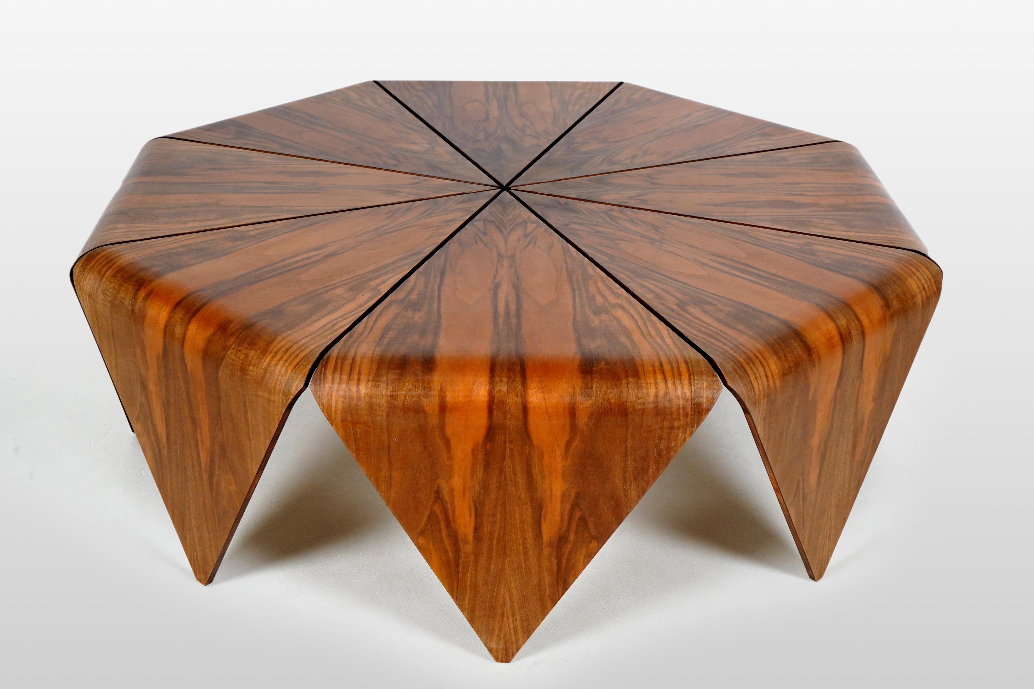 This table is made from the same Hungarian walnut wood veneers found in so many vintage Art Deco pieces. The construction is ingenious; each leg (and top segment) is made from a section of bent plywood, covered in very precisely matched walnut