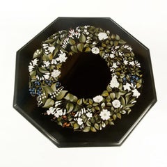An octagonal Derbyshire Black Marble table with Lapis Lazuli