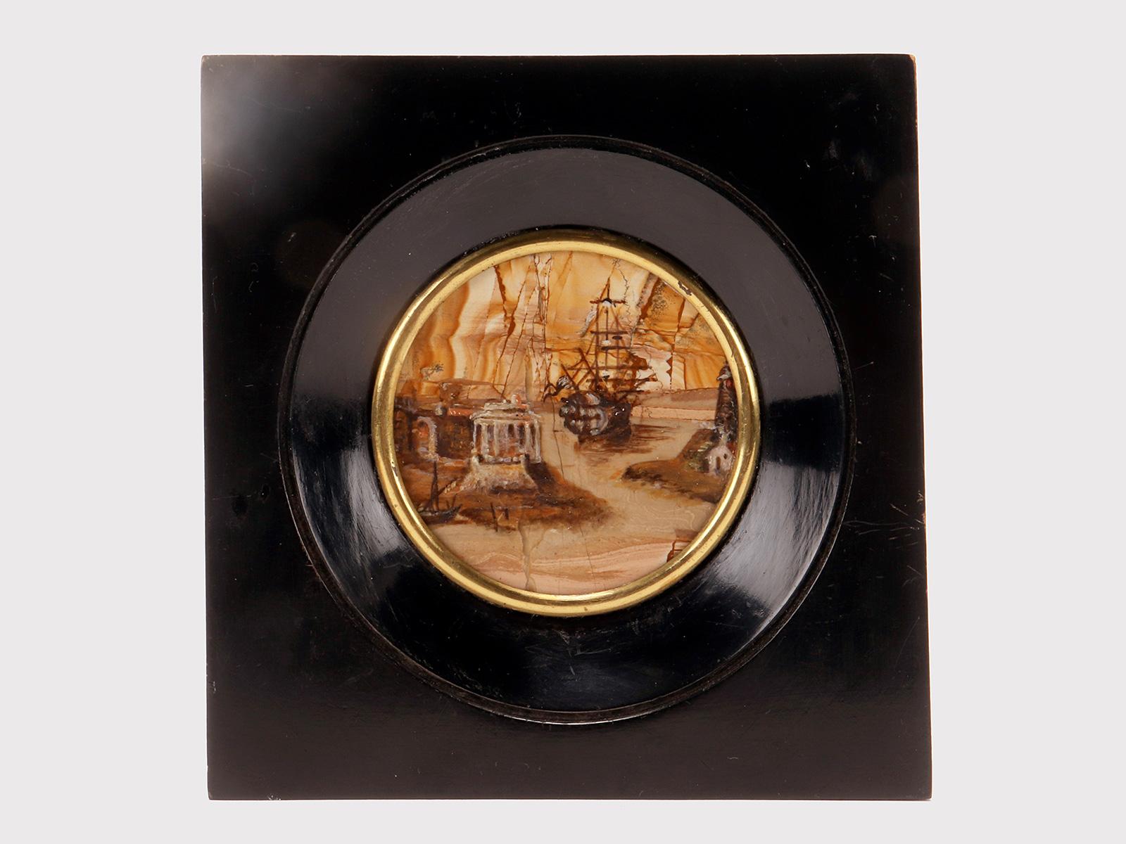 An oil genre painting on Paesina. The frame, made of ebonized fruit wood, has a square shape with a circular signature inside that flares out towards the inside to house the painting, finished with a double smooth gilded brass edge. Inside, on a