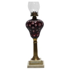 An Old Cranberry Cut To Clear Fluid Lamp