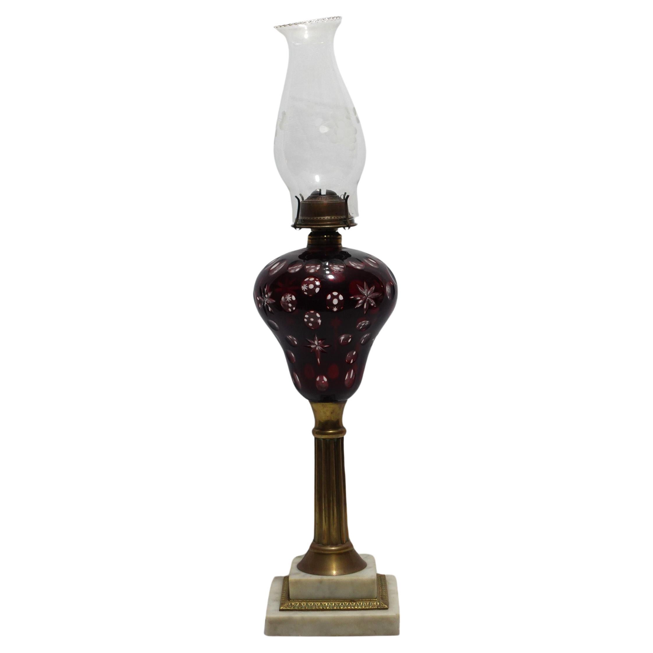 An Old Cranberry Cut To Clear Fluid Lamp For Sale