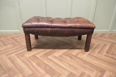 An Old Deeply Buttoned Chesterfield Leather Library Stool