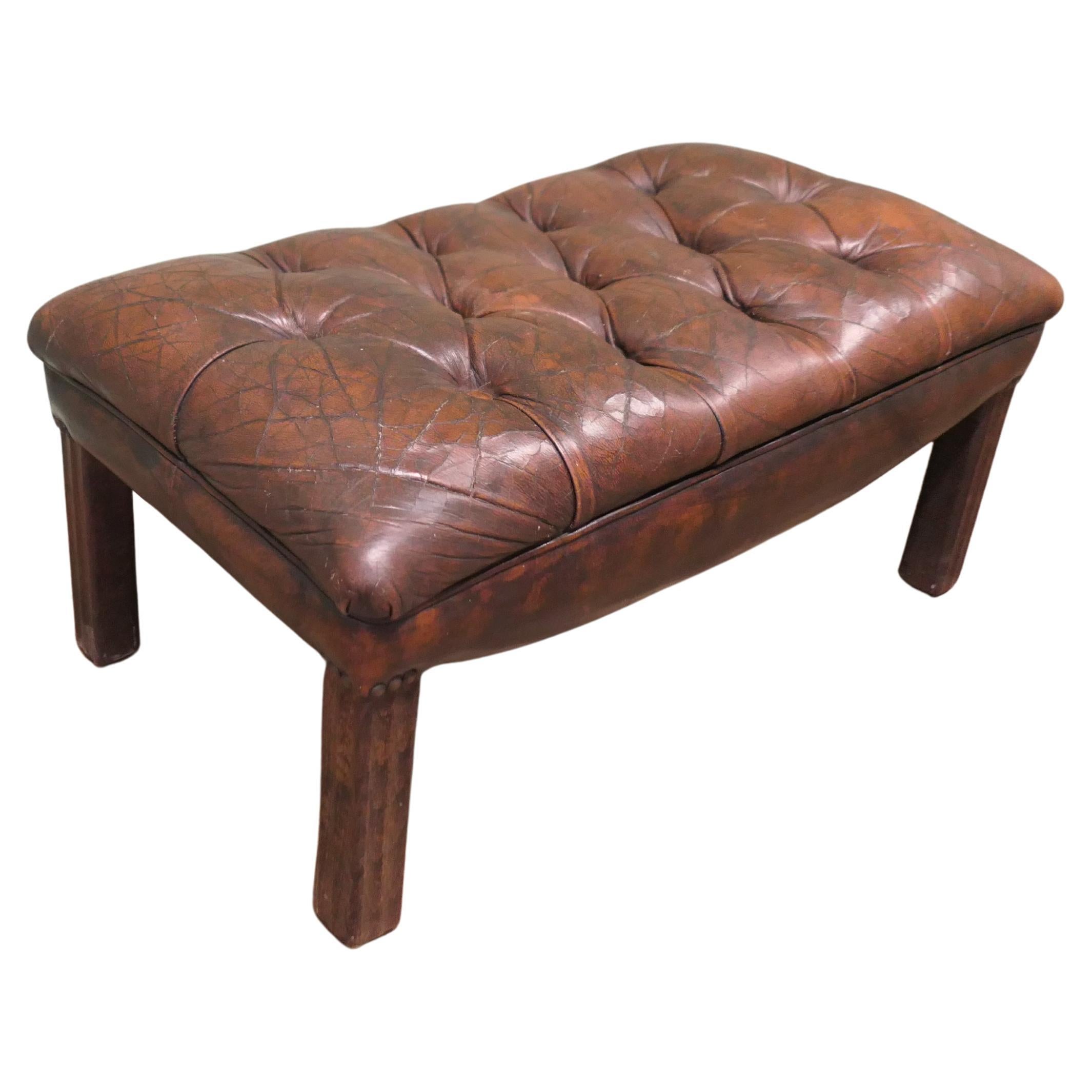 An Old Deeply Buttoned Chesterfield Leather Library Stool